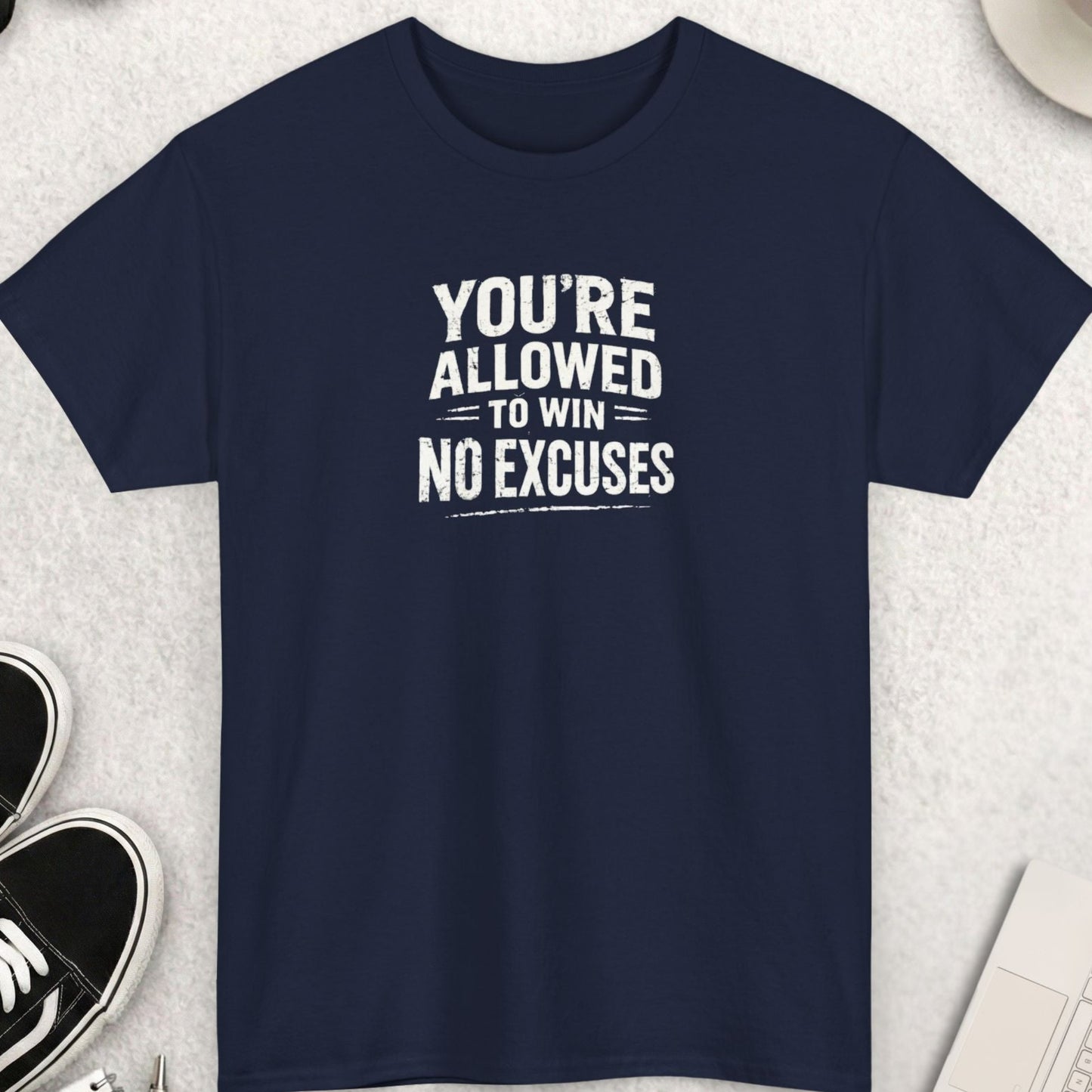 Navy blue t-shirt with “You’re allowed to win no excuses” motivational quote in distressed typography