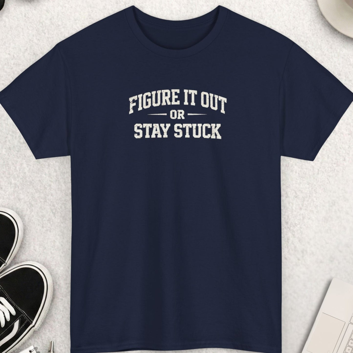 Navy blue t-shirt with “Figure It Out Or Stay Stuck” quote in distressed bold typography