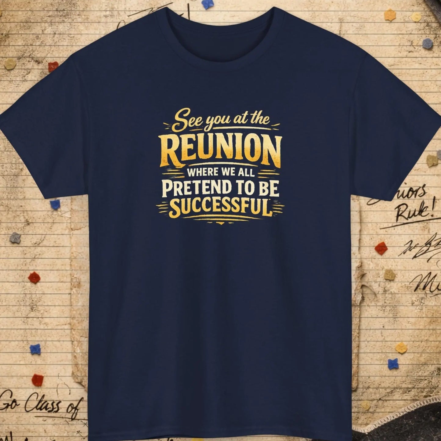 Navy blue t-shirt with yellow text on a textured background with confetti and signatures.