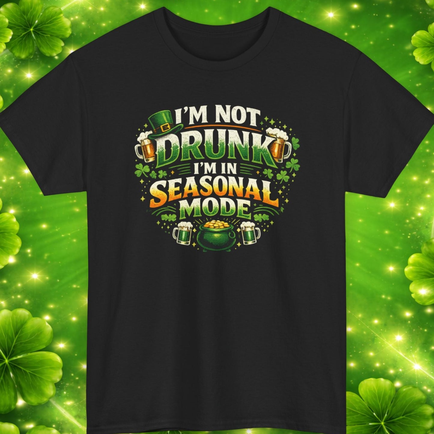 Black t-shirt with humorous text design on a green clover leaf pattern background