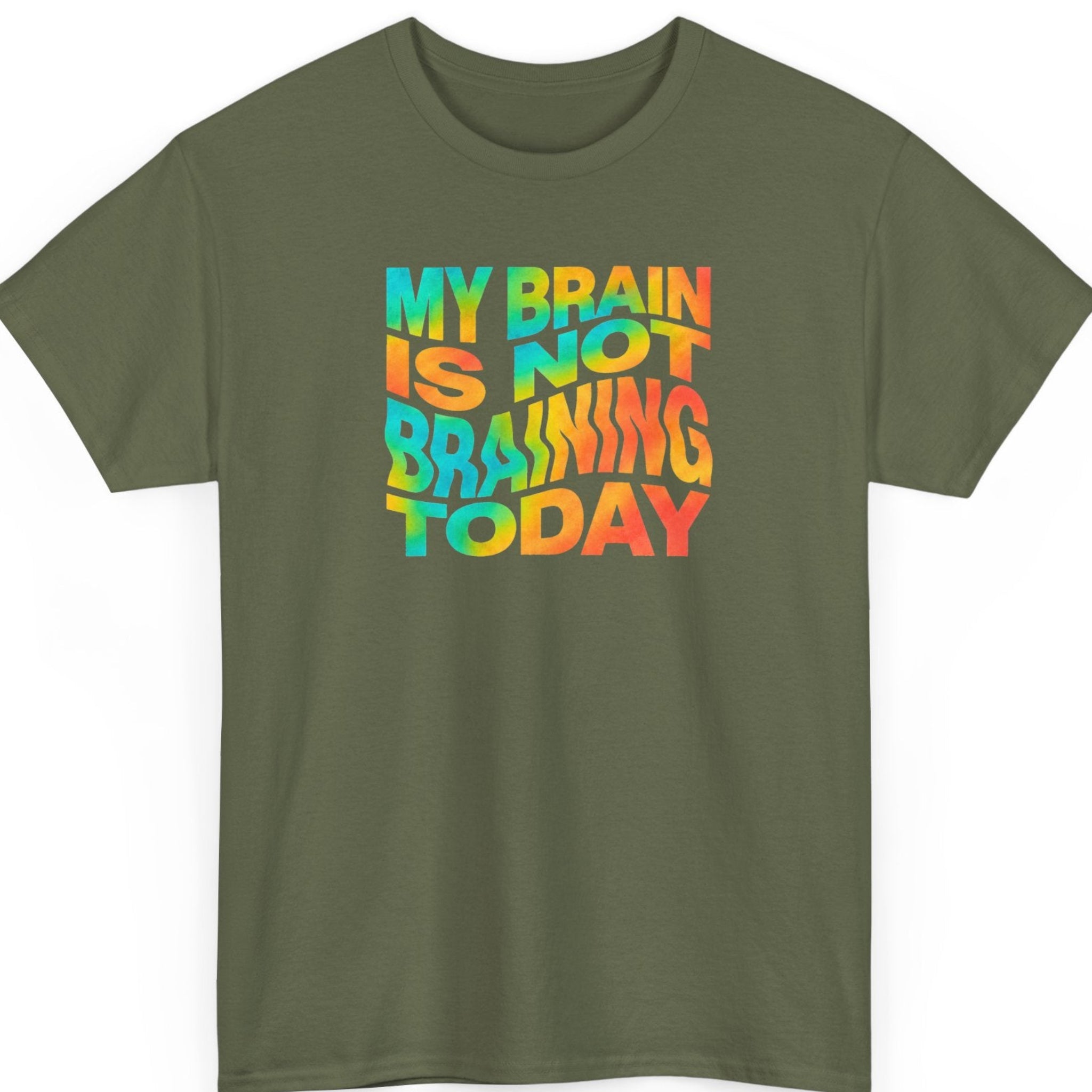 Mayhem Haus “My Brain Is Not Braining Today” military green t-shirt featuring bold multicolored psychedelic lettering with turquoise, yellow, orange, and coral gradients in a playful retro typography design.