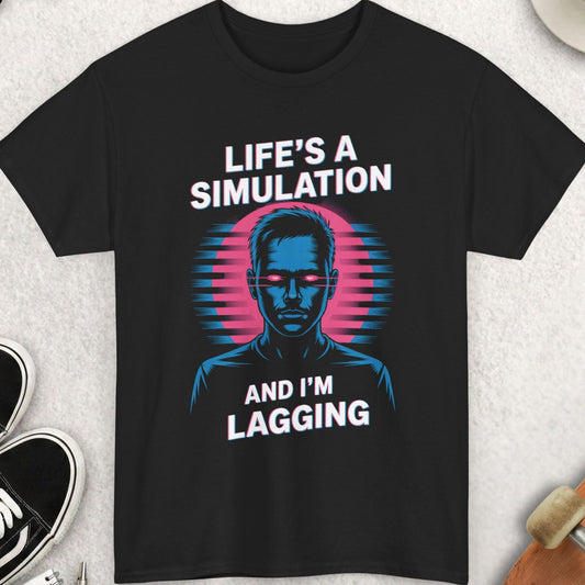 Black t-shirt with 'Life's a Simulation and I'm Lagging' design on a light gray surface with accessories.