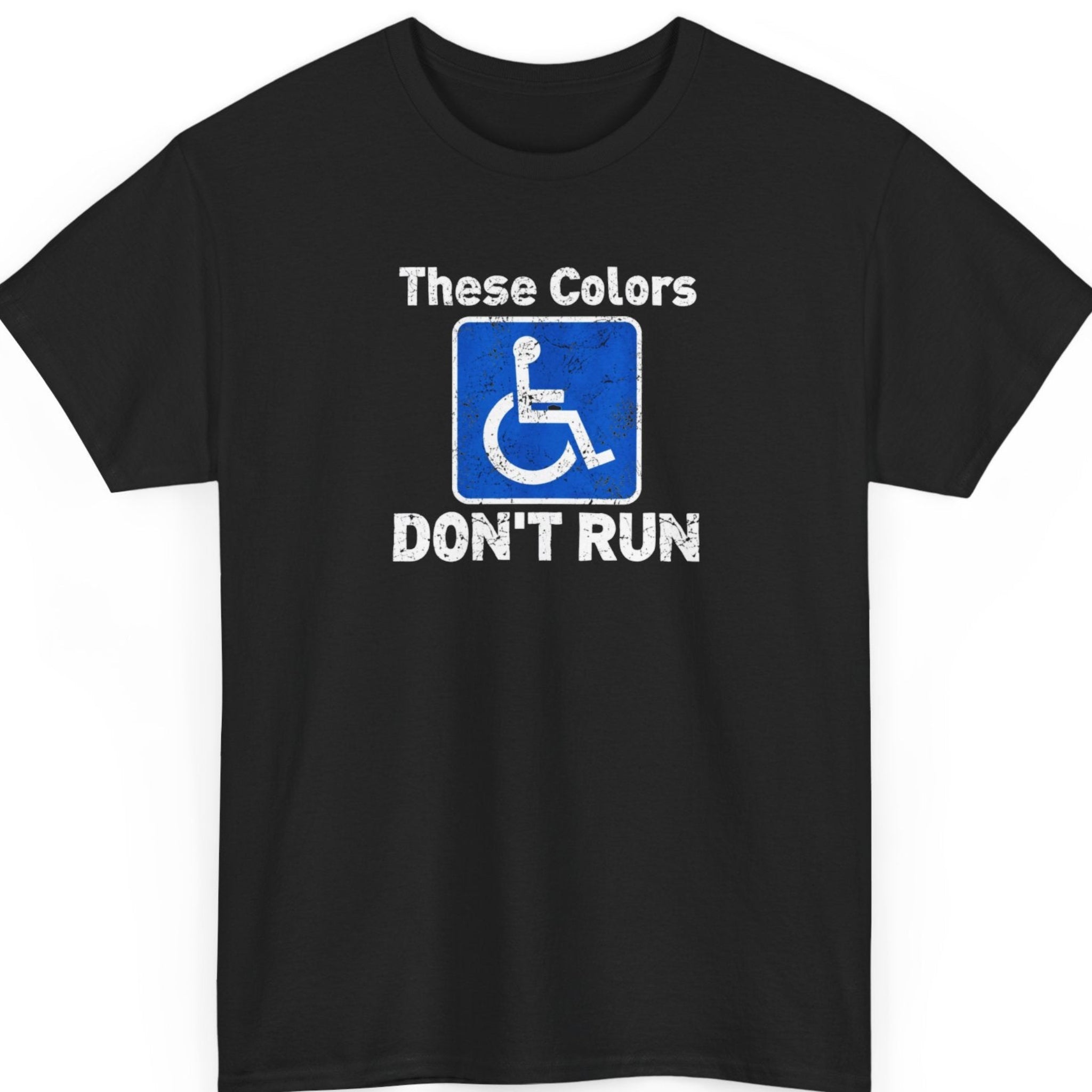 Mayhem Haus “These Colors Don't Run” black t-shirt featuring distressed white typography surrounding a blue wheelchair accessibility symbol, creating a sarcastic visual pun with a bold, minimalist design.