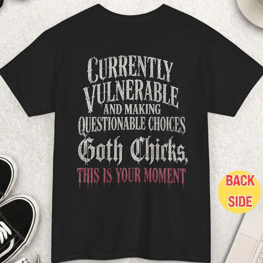 Black t-shirt featuring distressed gothic dripping typography reading “Currently Vulnerable and Making Questionable Choices Goth Chicks This Is Your Moment” in a bold alt-style design.