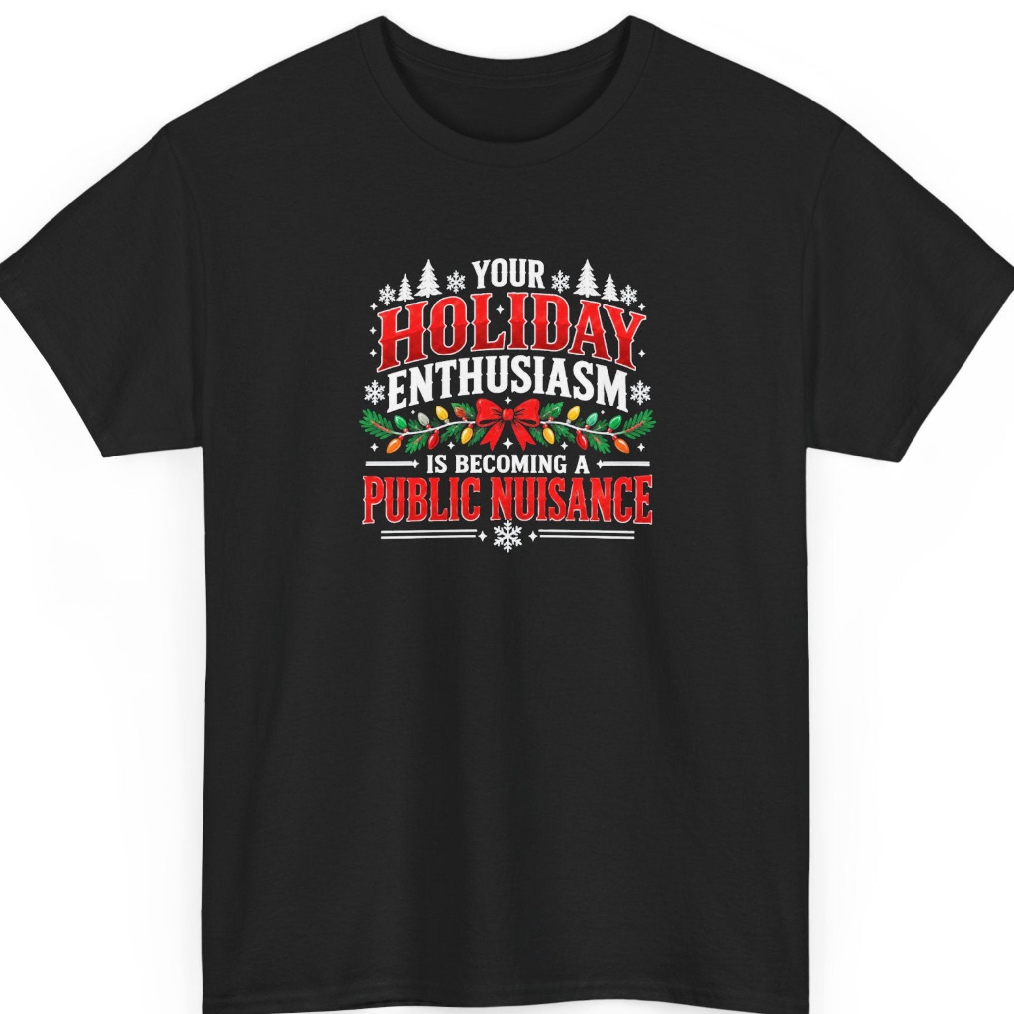Mayhem Haus “Your Holiday Enthusiasm Is Becoming a Public Nuisance” black t-shirt featuring bold distressed red and white Christmas typography, decorated with evergreen branches, colorful Christmas lights, a red bow, snowflakes, and festive pine trees.