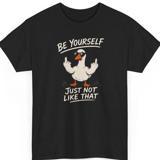 Mayhem Haus "Be Yourself Just Not Like That" graphic t-shirt on a black shirt featuring a funny duck wearing sunglasses and raising both middle fingers with distressed cream typography.