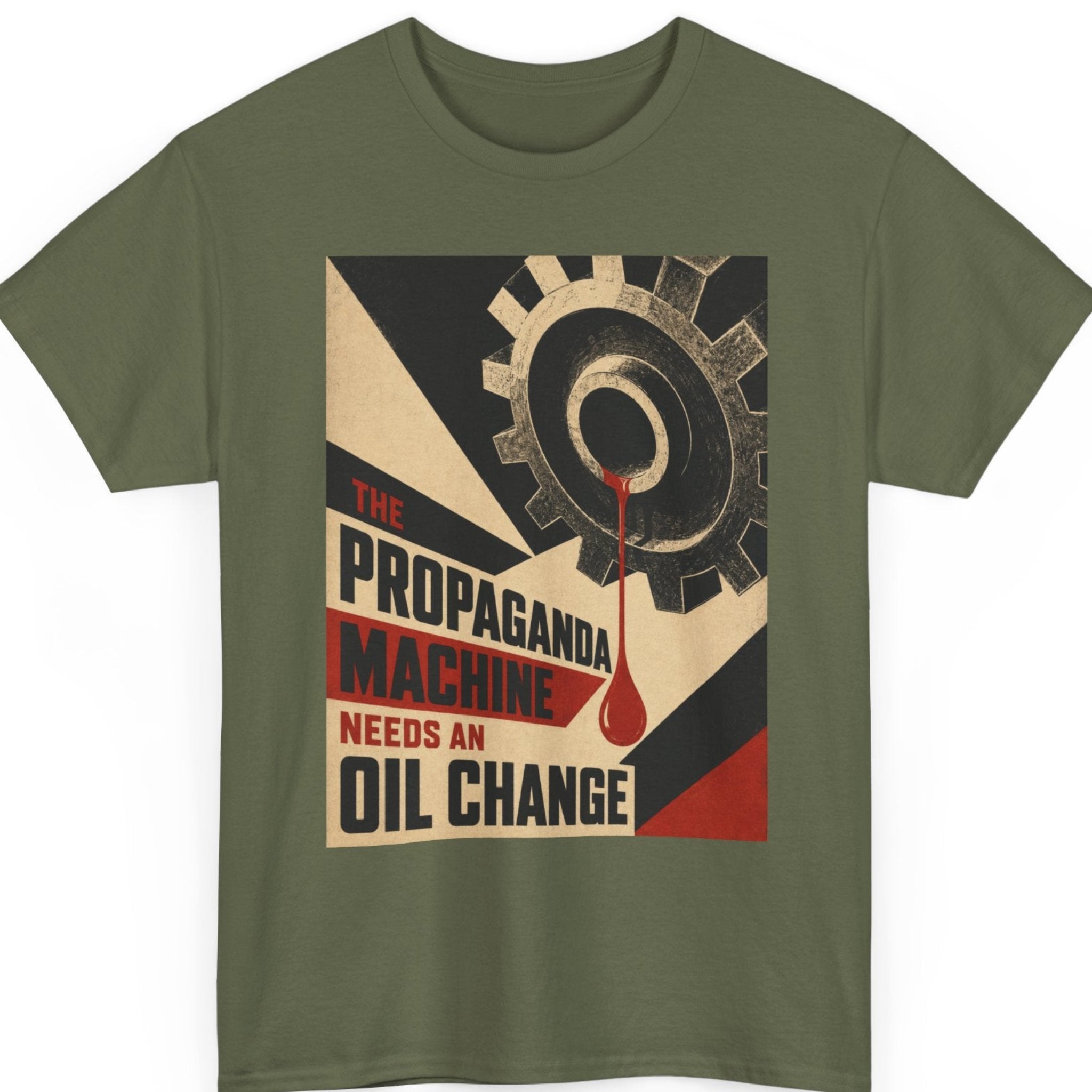 Mayhem Haus vintage statement shirt on a military green tee featuring an industrial gear illustration with distressed cream, black, and red geometric graphics alongside the phrase "The Propaganda Machine Needs An Oil Change."