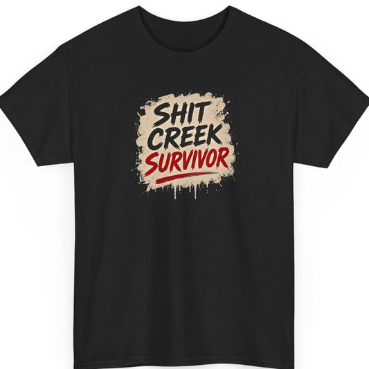 Mayhem Haus "Shit Creek Survivor" graphic t-shirt on a black shirt featuring bold distressed brush lettering in black and red over a rugged beige paint splatter background with dripping grunge effects.