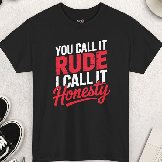 Black t-shirt with text 'You call it rude, I call it honesty' on a light gray surface with shoes and coffee.
