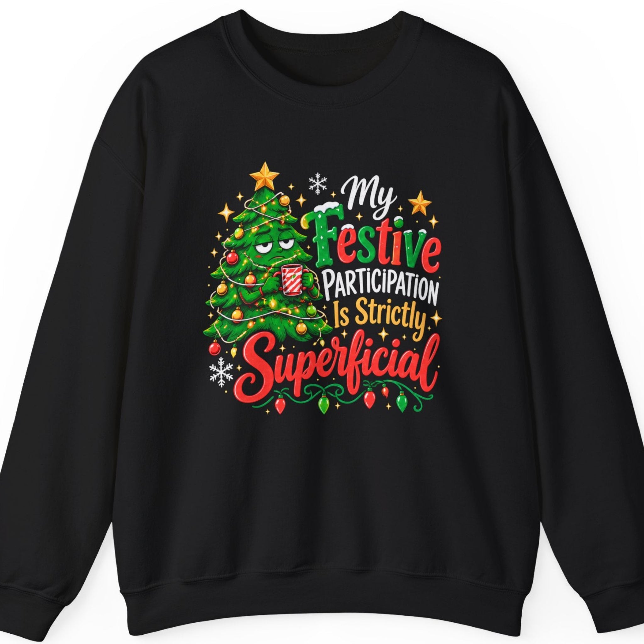 Mayhem Haus “My Festive Participation Is Strictly Superficial” black crewneck sweatshirt featuring a sarcastic Christmas tree character with tired eyes, decorated with multicolored ornaments and string lights while holding a striped holiday mug. Bright red, green, white, and gold Christmas lettering is accented with snowflakes, golden stars, and decorative holiday lights.
