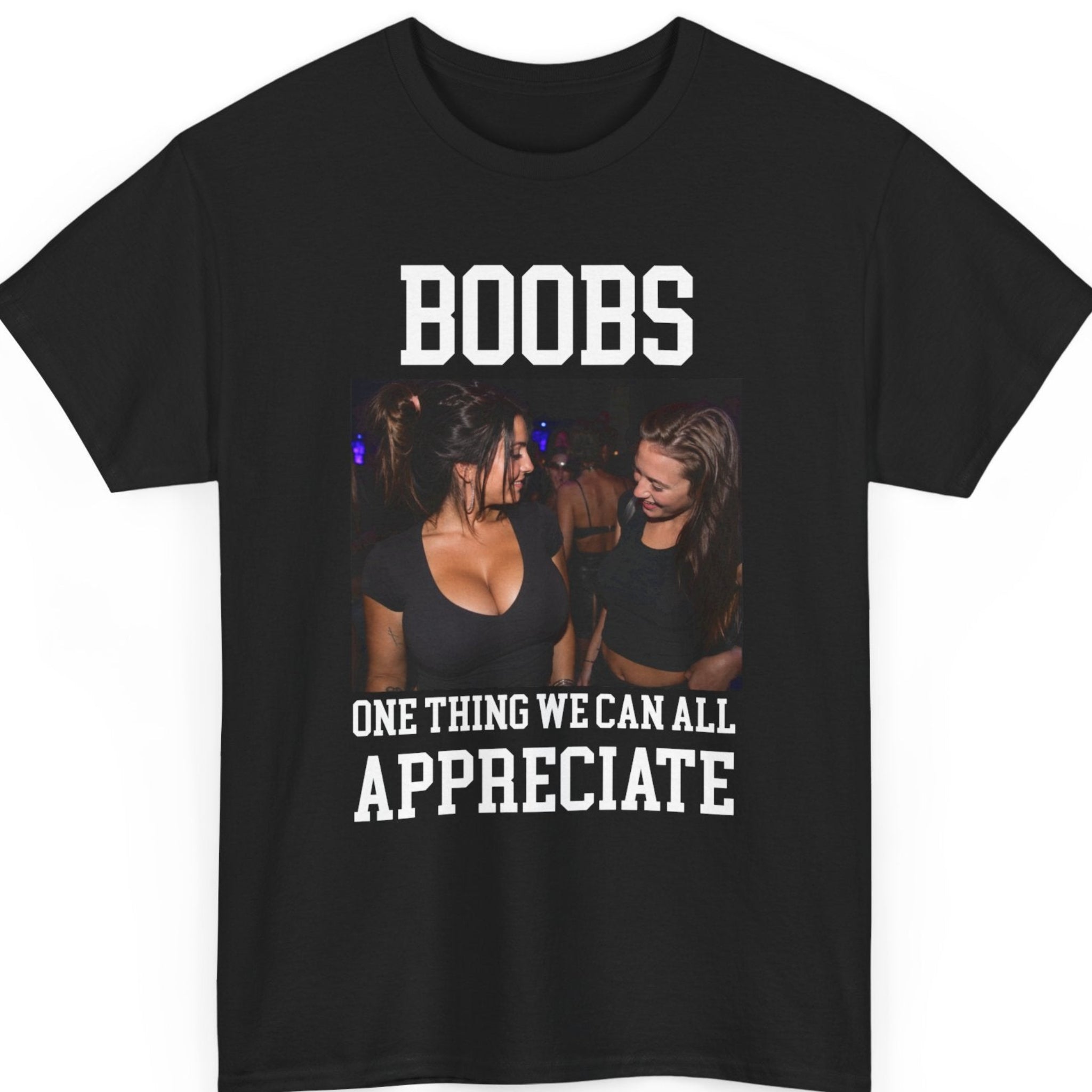 Mayhem Haus funny novelty t-shirt on a black shirt featuring the phrase "Boobs One Thing We Can All Appreciate" with a nightlife photo of two women smiling in a club.