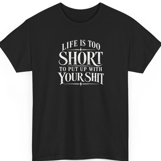 Mayhem Haus “Life Is Too Short To Put Up With Your Shit” black t-shirt featuring distressed white vintage serif typography, oversized lettering emphasizing “Short” and “Your Shit,” and decorative lines with star accents.