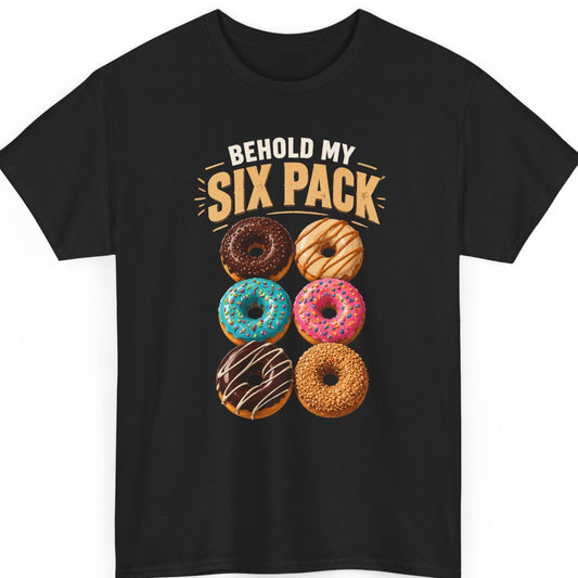 Mayhem Haus “Behold My Six Pack” black t-shirt featuring bold cream and golden-orange typography above six colorful donuts arranged in two columns, including chocolate, caramel, turquoise, pink, and nut-covered varieties.