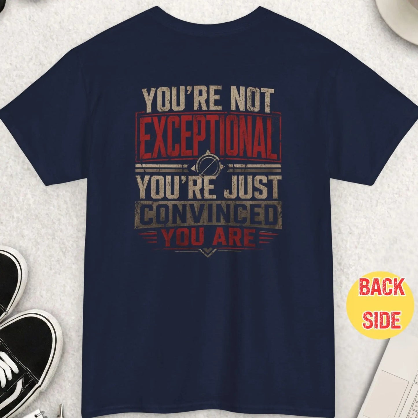 Navy blue t-shirt featuring a distressed bold text design stating “You’re Not Exceptional You’re Just Convinced You Are” in a vintage-style red and off-white color palette.