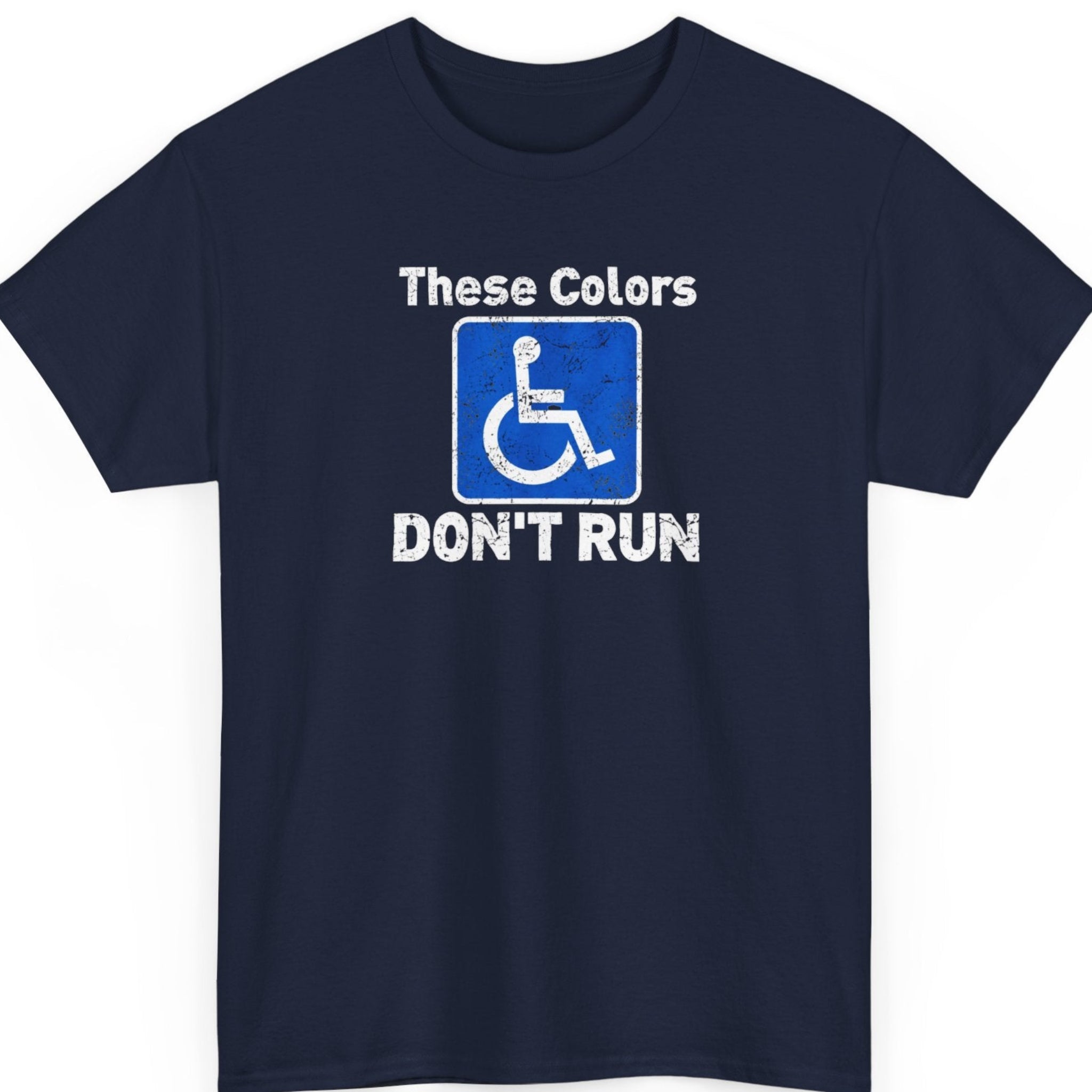 Mayhem Haus “These Colors Don't Run” navy blue t-shirt featuring a weathered blue accessibility sign with a white wheelchair symbol, framed by distressed white lettering and a cheeky disability-related joke.