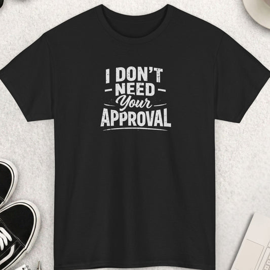 Black t-shirt with 'I don't need your approval' text on a light gray surface with shoes, coffee, and accessories.