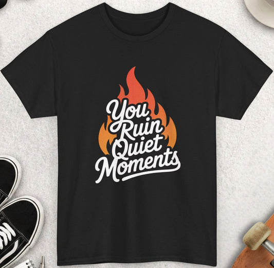 Black t-shirt with 'You Ruin Quiet Moments' design on a light gray surface with accessories.
