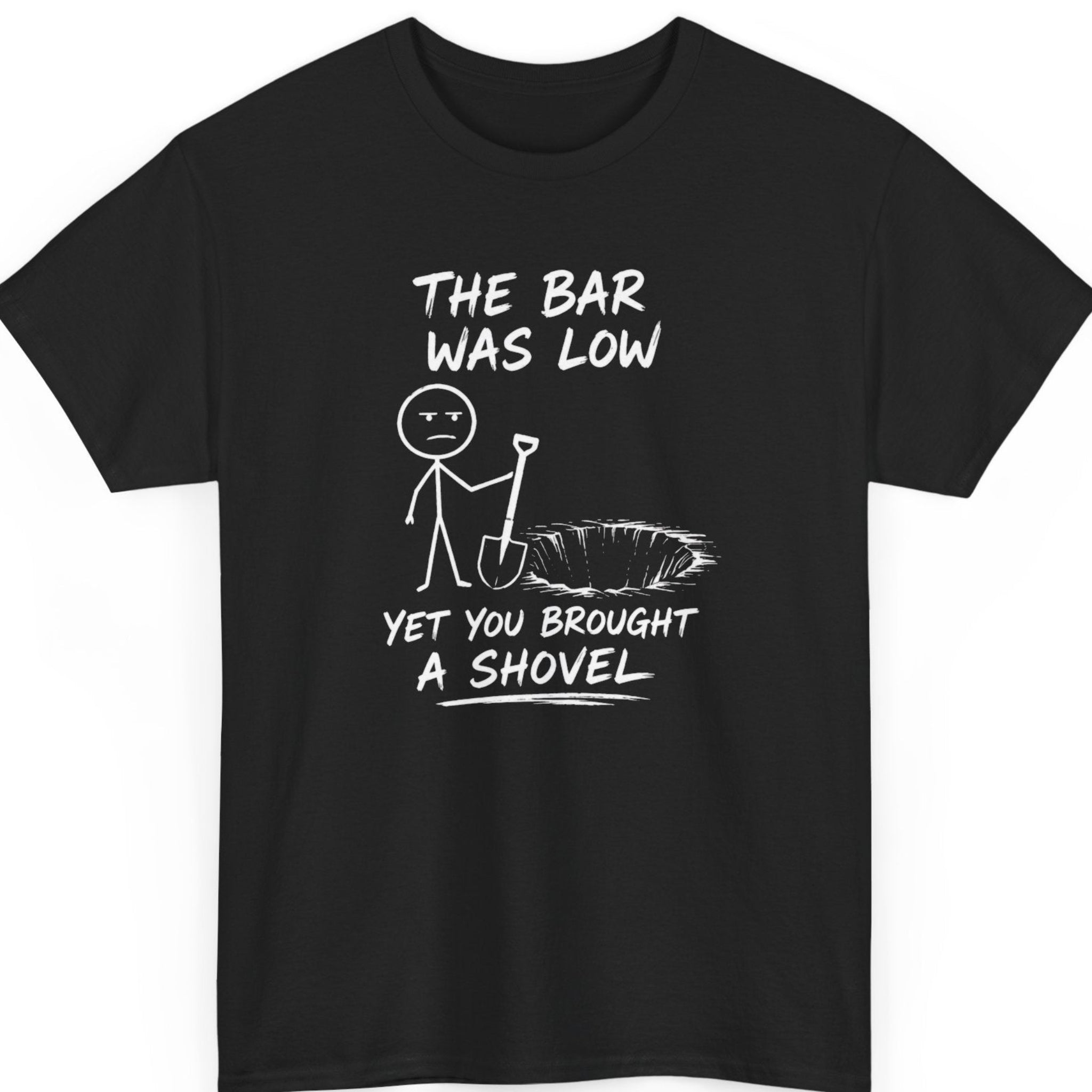 mayhem haus black funny sarcastic t-shirt featuring a stick figure holding a shovel beside a giant hole with the phrase "The Bar Was Low Yet You Brought a Shovel" in distressed white lettering.