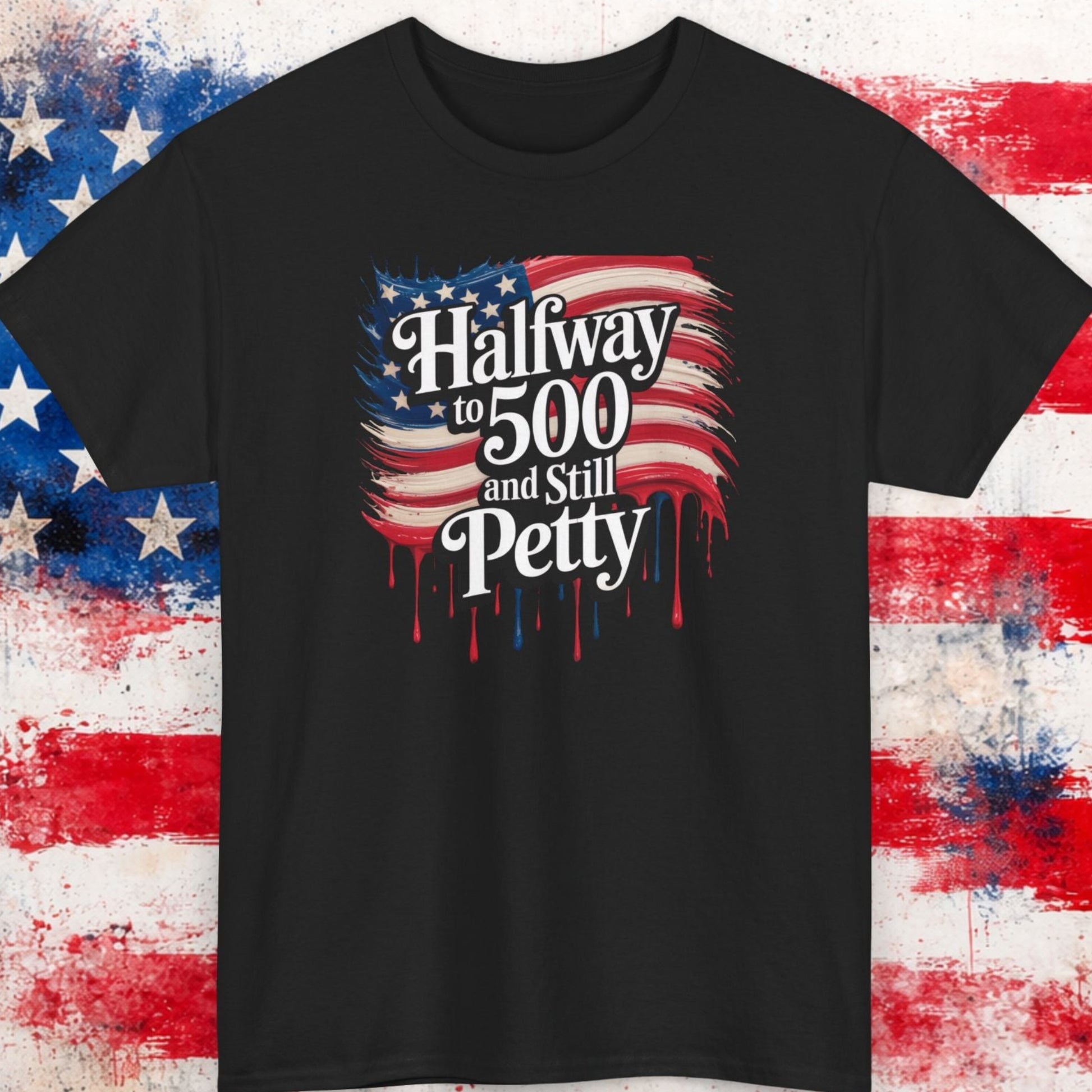 Black t-shirt with American flag design and text on a textured surface with American flag pattern