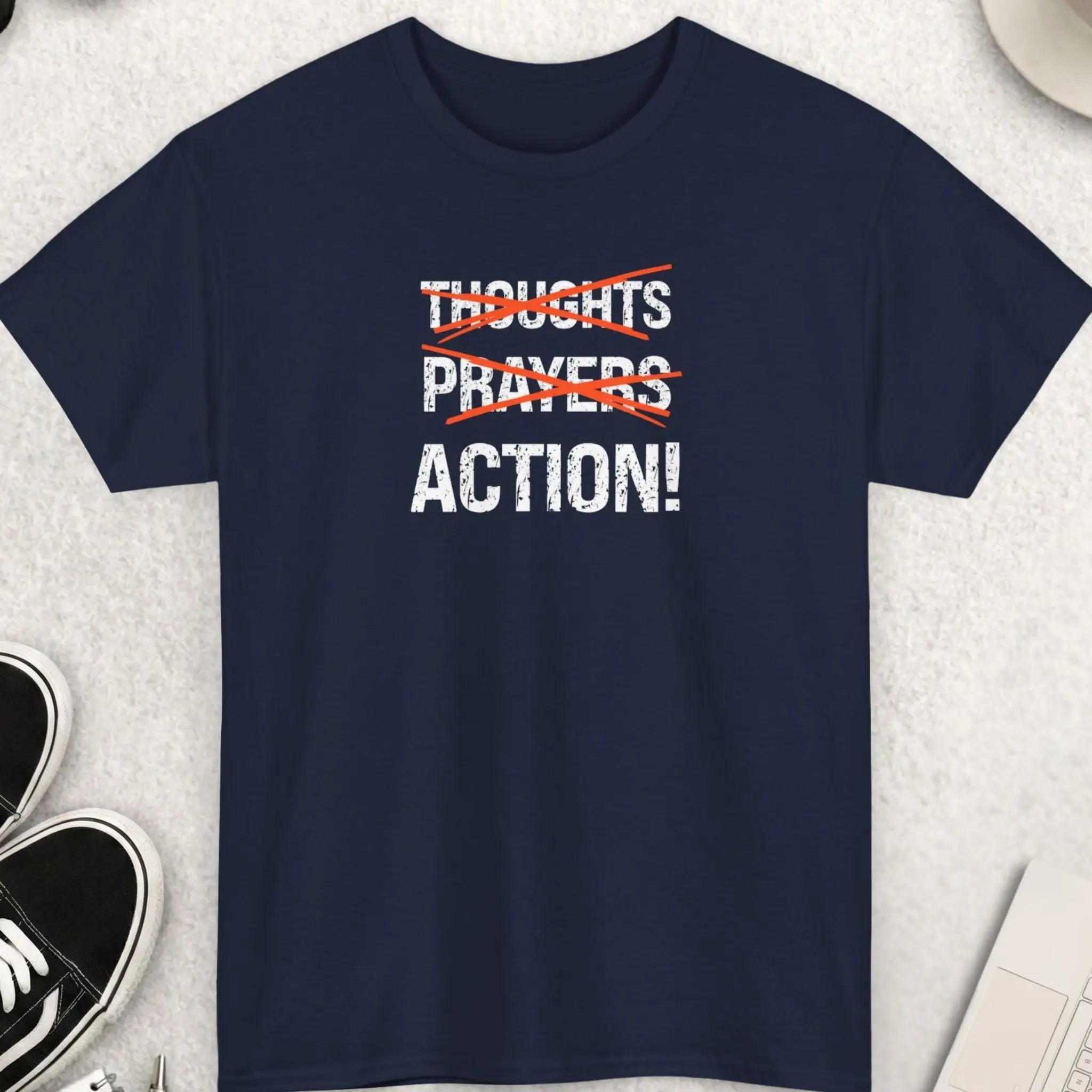Navy blue t-shirt with distressed “Thoughts Prayers Action” statement graphic and red strike-through design