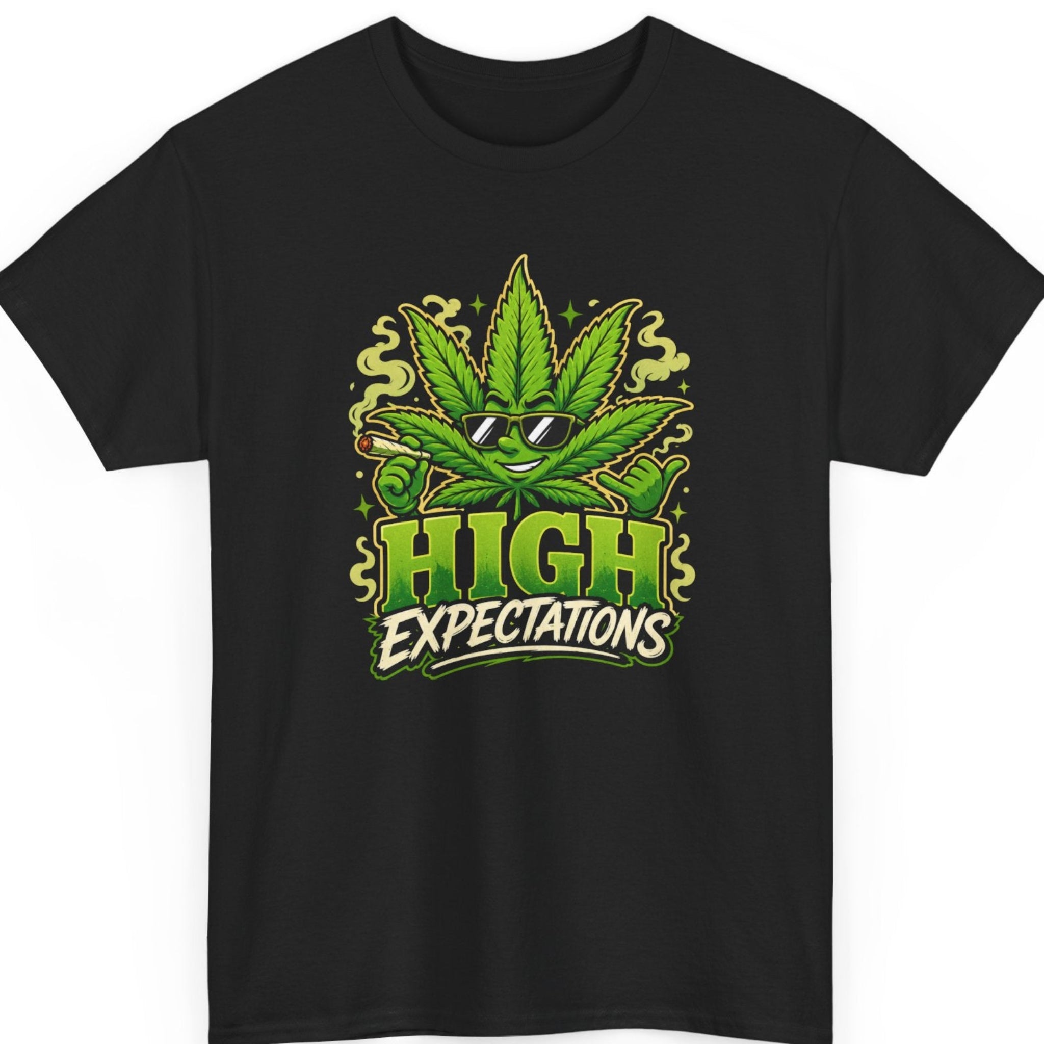 Mayhem Haus "High Expectations" cannabis graphic t-shirt on a black shirt featuring a cool cartoon marijuana leaf wearing sunglasses, holding a lit joint, making a shaka hand gesture, and bold green typography.