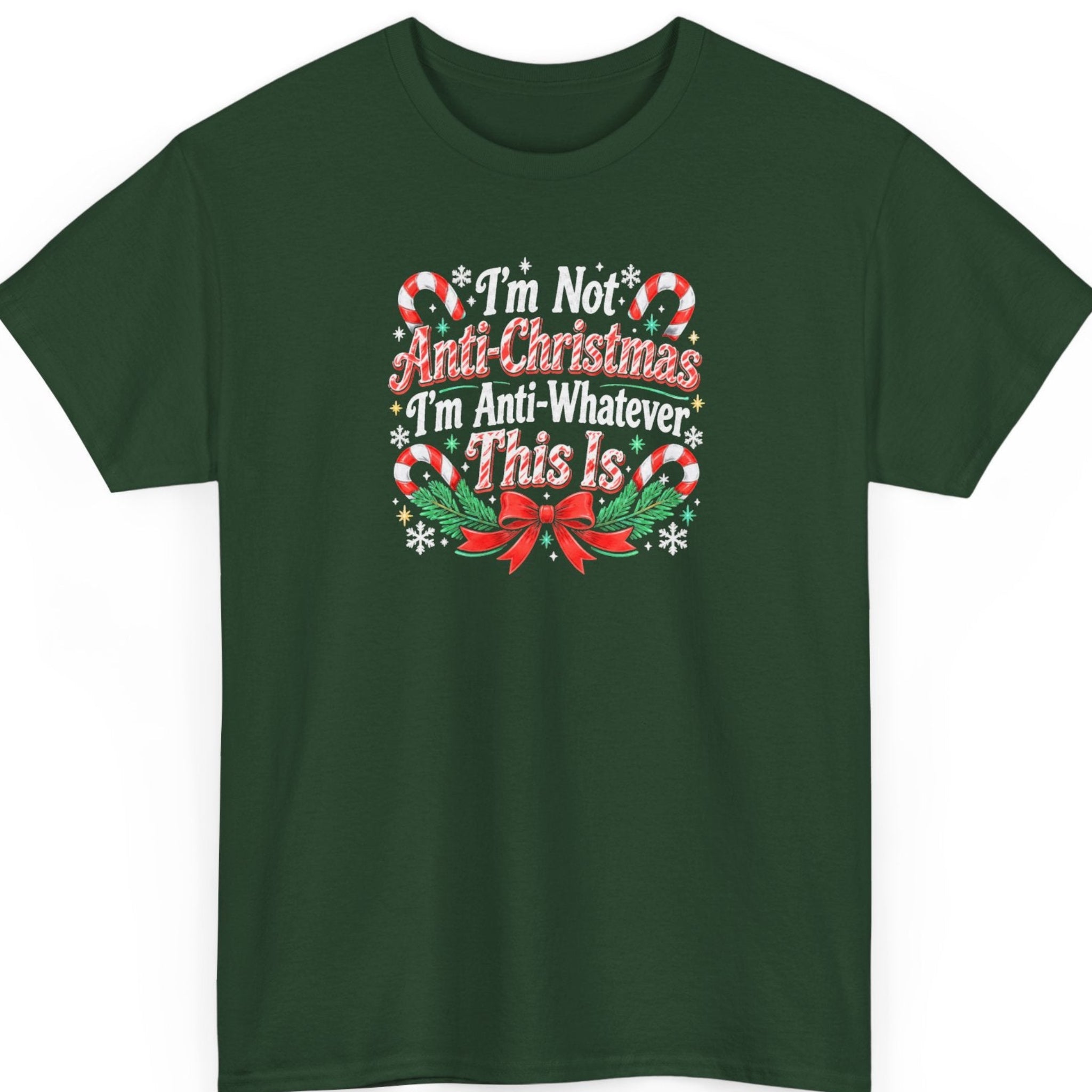Mayhem Haus “I'm Not Anti-Christmas I'm Anti-Whatever This Is” forest green t-shirt featuring bold distressed Christmas lettering in red and white, framed by striped candy canes, white snowflakes, golden stars, green holly, and a decorative red ribbon bow.