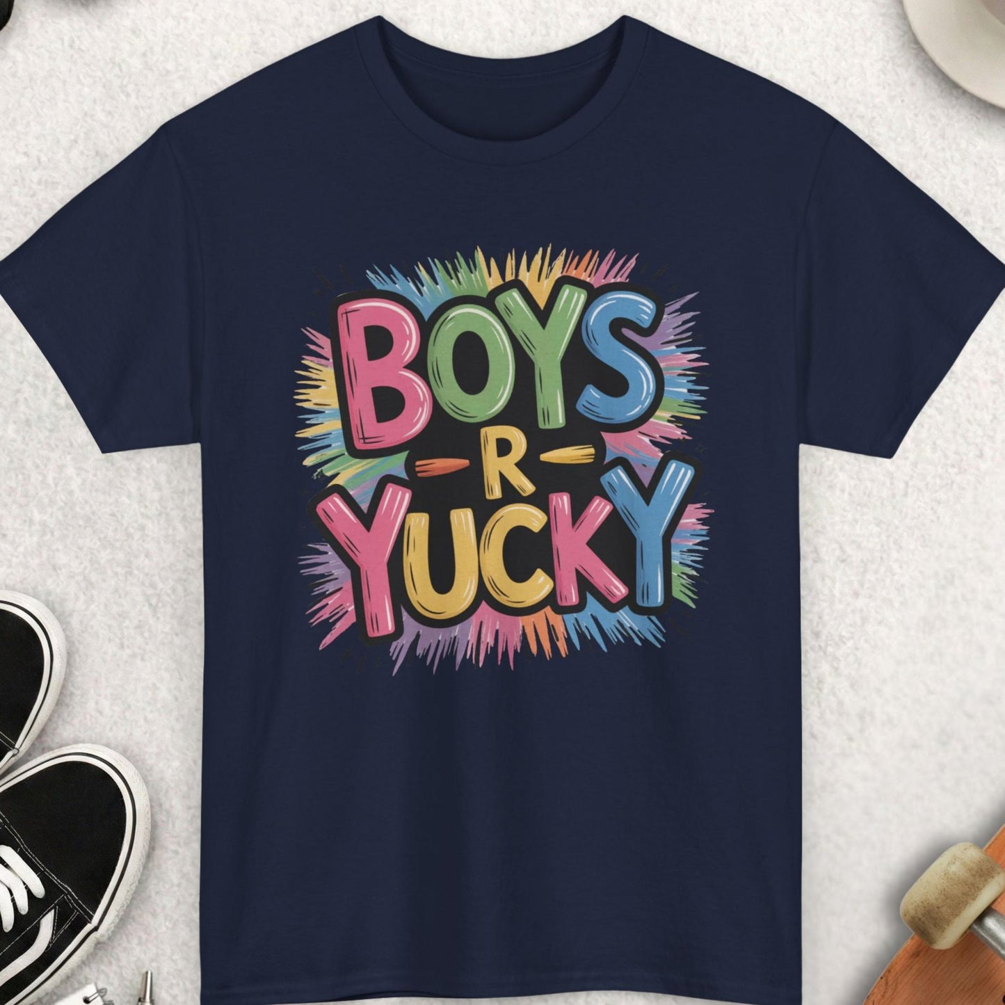 Navy blue t-shirt with colorful 'Boys R Yucky' text on a light gray surface with accessories.