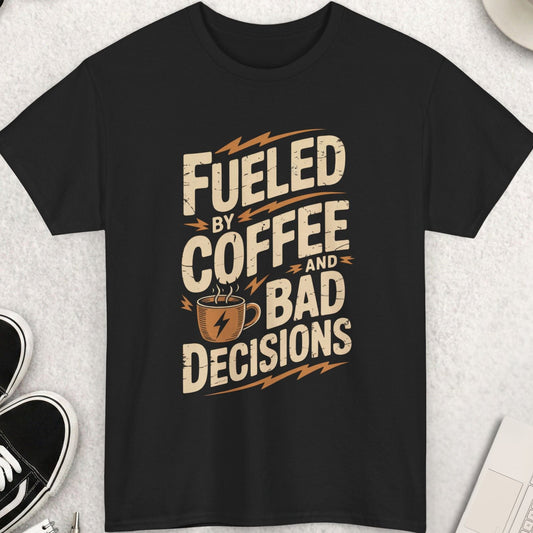 Black t-shirt with 'Fueled by Coffee and Bad Decisions' text on a light gray surface with shoes, coffee, and accessories.