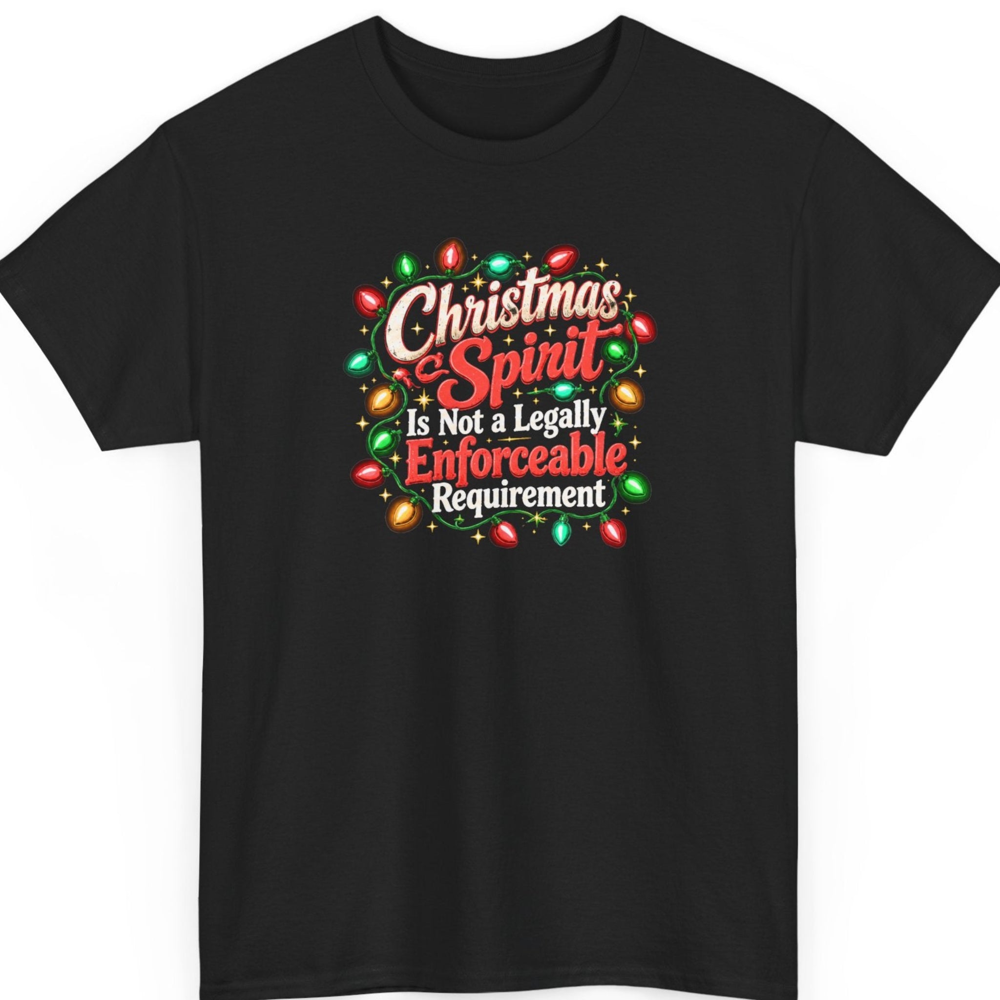Mayhem Haus “Christmas Spirit Is Not a Legally Enforceable Requirement” black t-shirt featuring distressed cream-white and red vintage Christmas typography surrounded by glowing red, green, and golden holiday string lights, decorative gold stars, and festive ornamental accents.