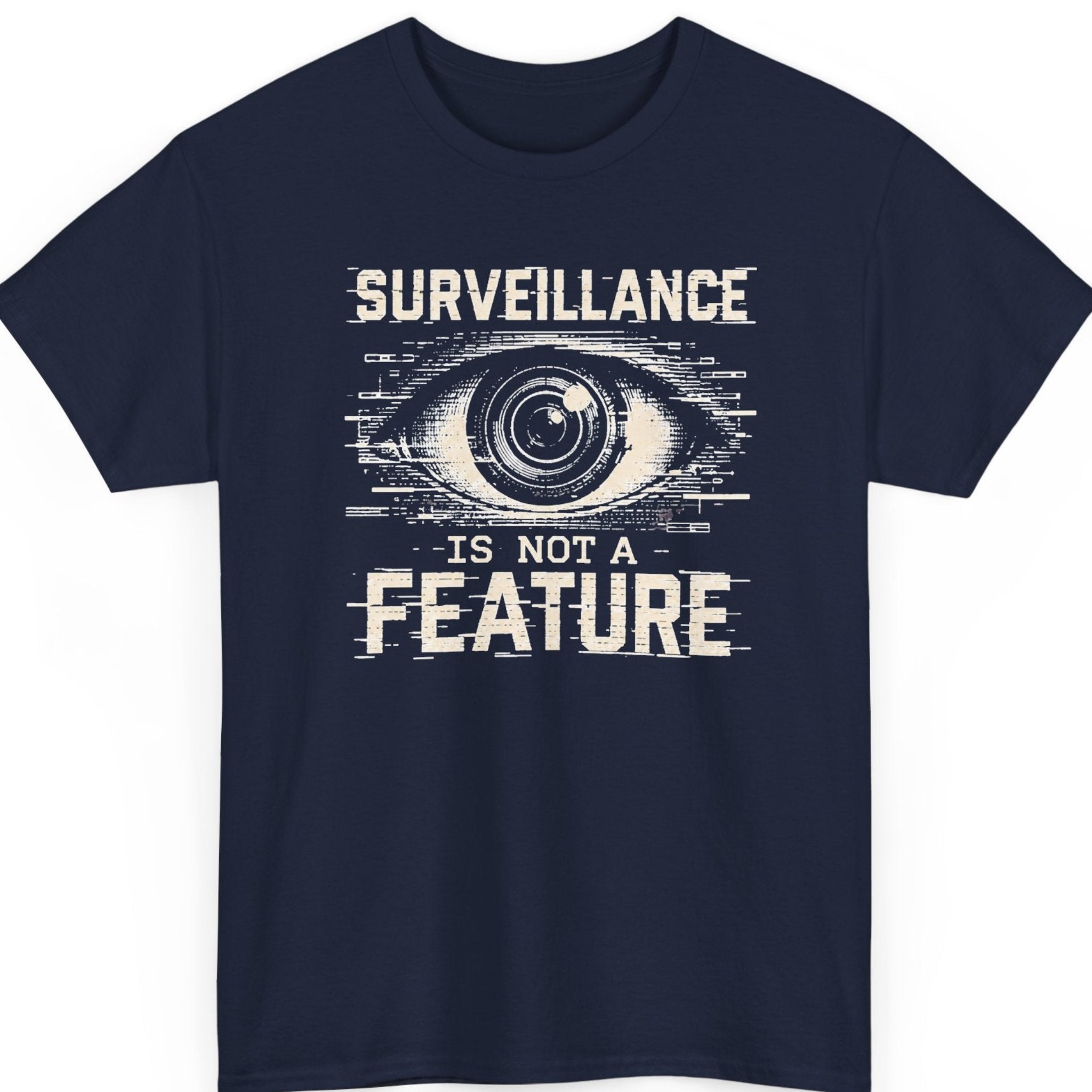 Mayhem Haus “Surveillance Is Not a Feature” navy blue t-shirt featuring a large distressed surveillance eye surrounded by digital glitch lines and bold statement typography.