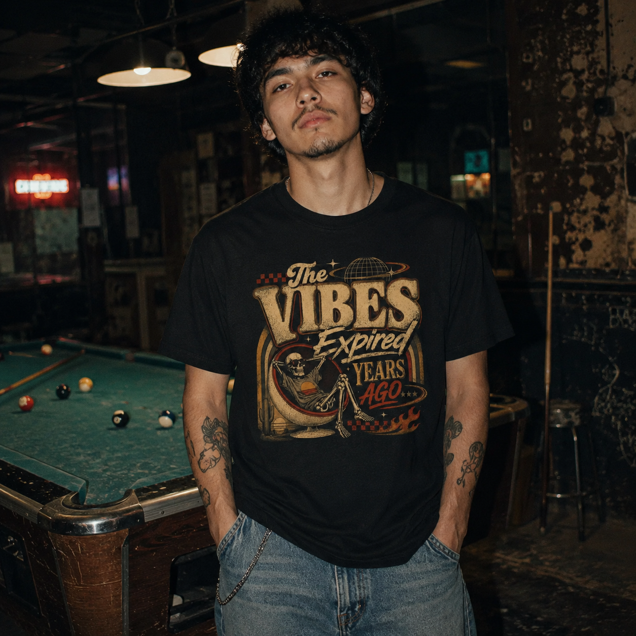 Mayhem Haus The Vibes Expired Years Ago T-Shirt on a man in a pool hall