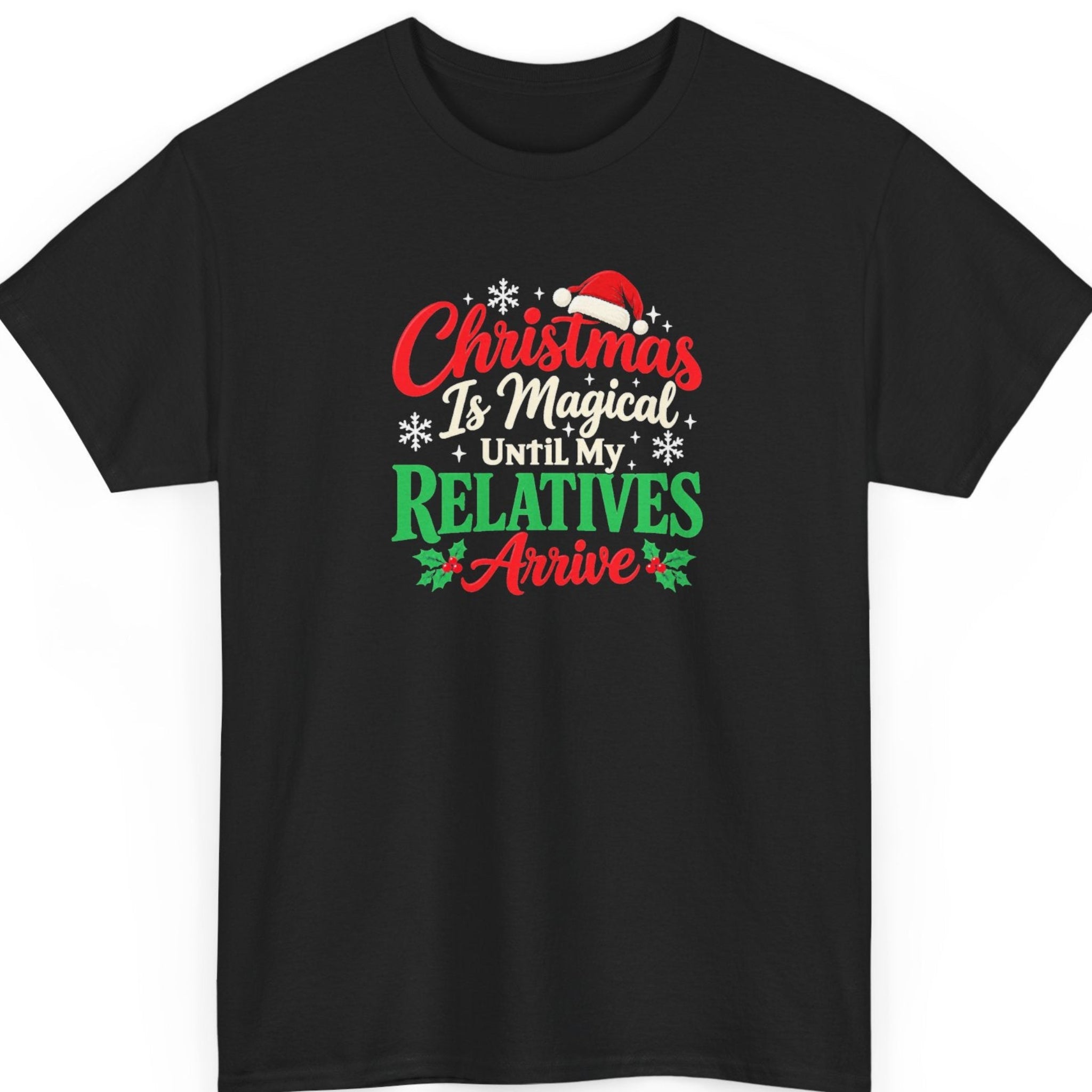 Mayhem Haus “Christmas Is Magical Until My Relatives Arrive” black t-shirt featuring festive red, green, and cream typography with a Santa hat, white snowflakes, and holly berries in a distressed Christmas design.