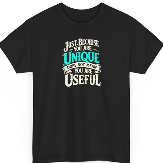 Mayhem Haus “Just Because You Are Unique Does Not Mean You Are Useful” black t-shirt featuring distressed vintage typography in cream and turquoise, with decorative flourishes and a ribbon banner emphasizing the sarcastic statement.
