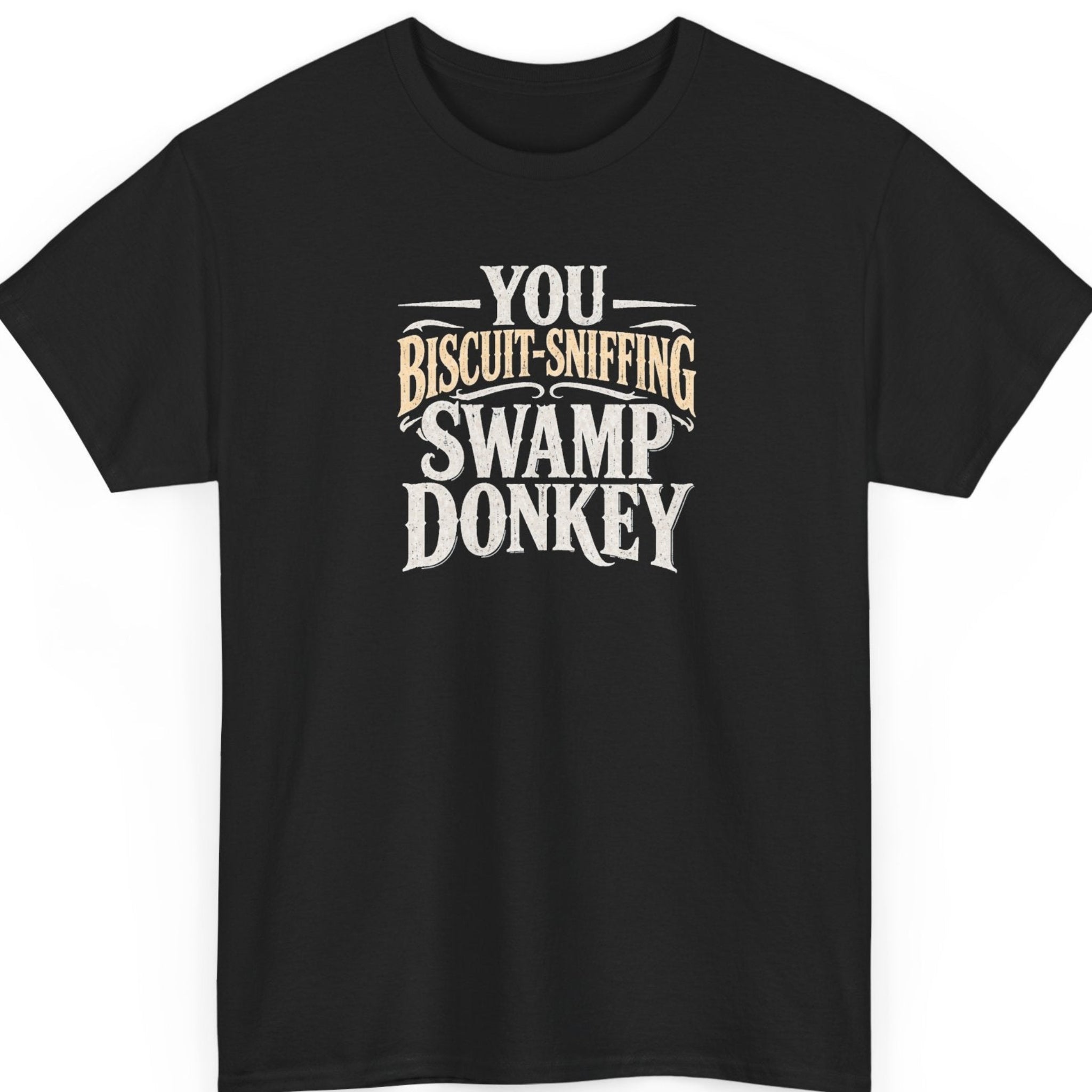 Mayhem Haus “You Biscuit-Sniffing Swamp Donkey” black t-shirt featuring distressed cream and tan Western-style typography in a ridiculous insult design.