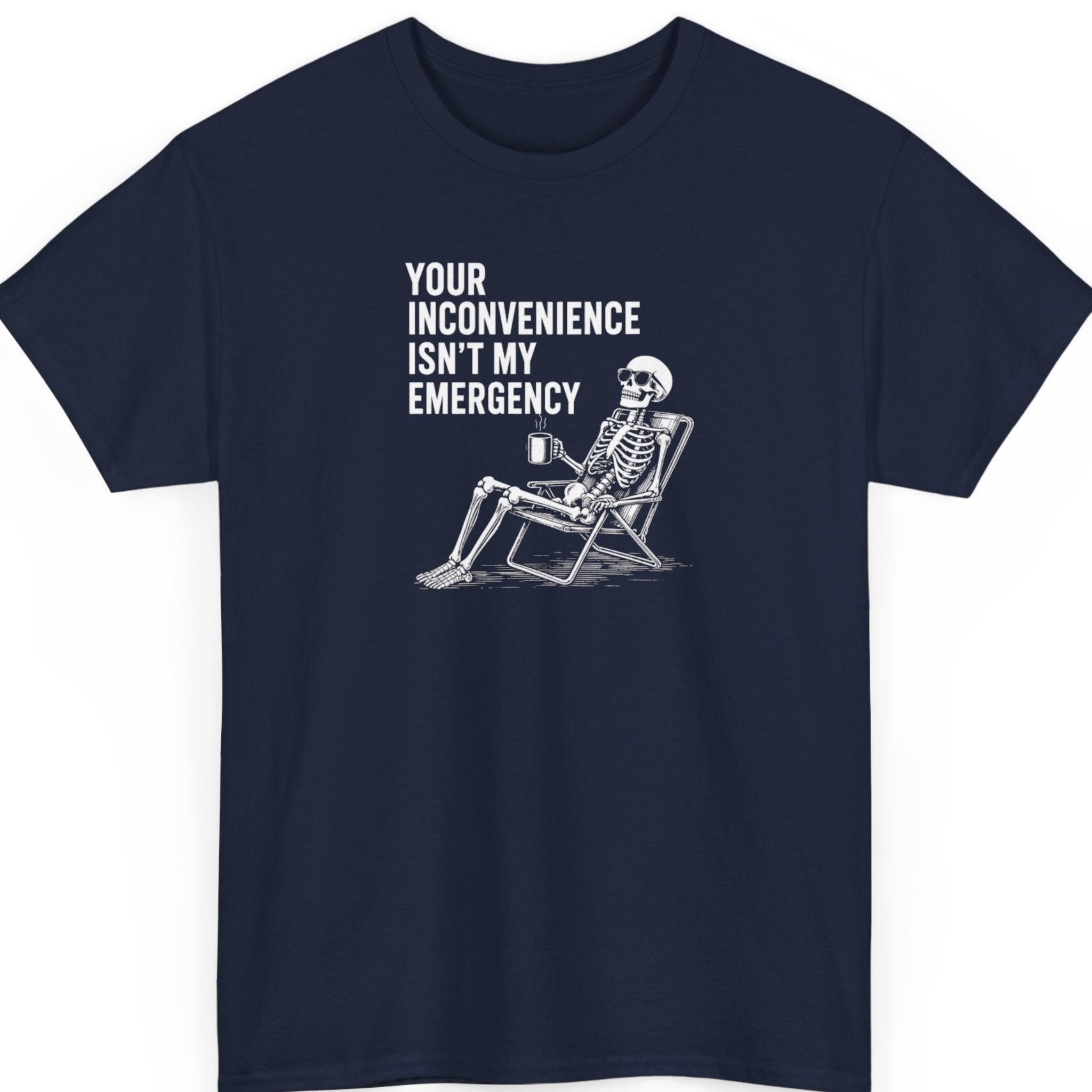 Mayhem Haus sarcastic graphic tee on a navy blue shirt featuring distressed white typography with a lounging skeleton holding a coffee cup beside the phrase "Your Inconvenience Isn't My Emergency."