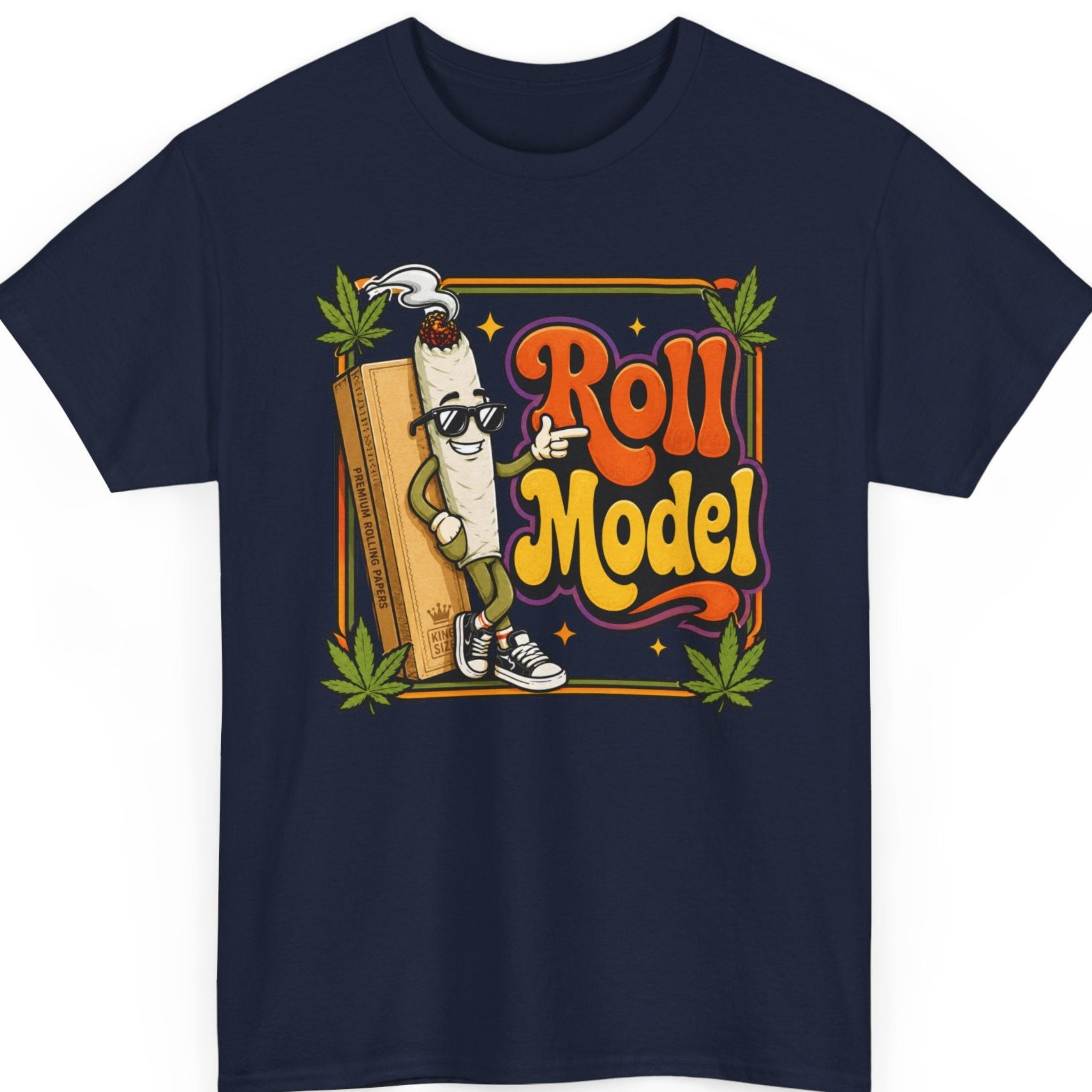 Mayhem Haus weed graphic tee on a navy blue shirt featuring a smiling cartoon joint, rolling paper pack, vintage "Roll Model" lettering, and green cannabis leaf accents.