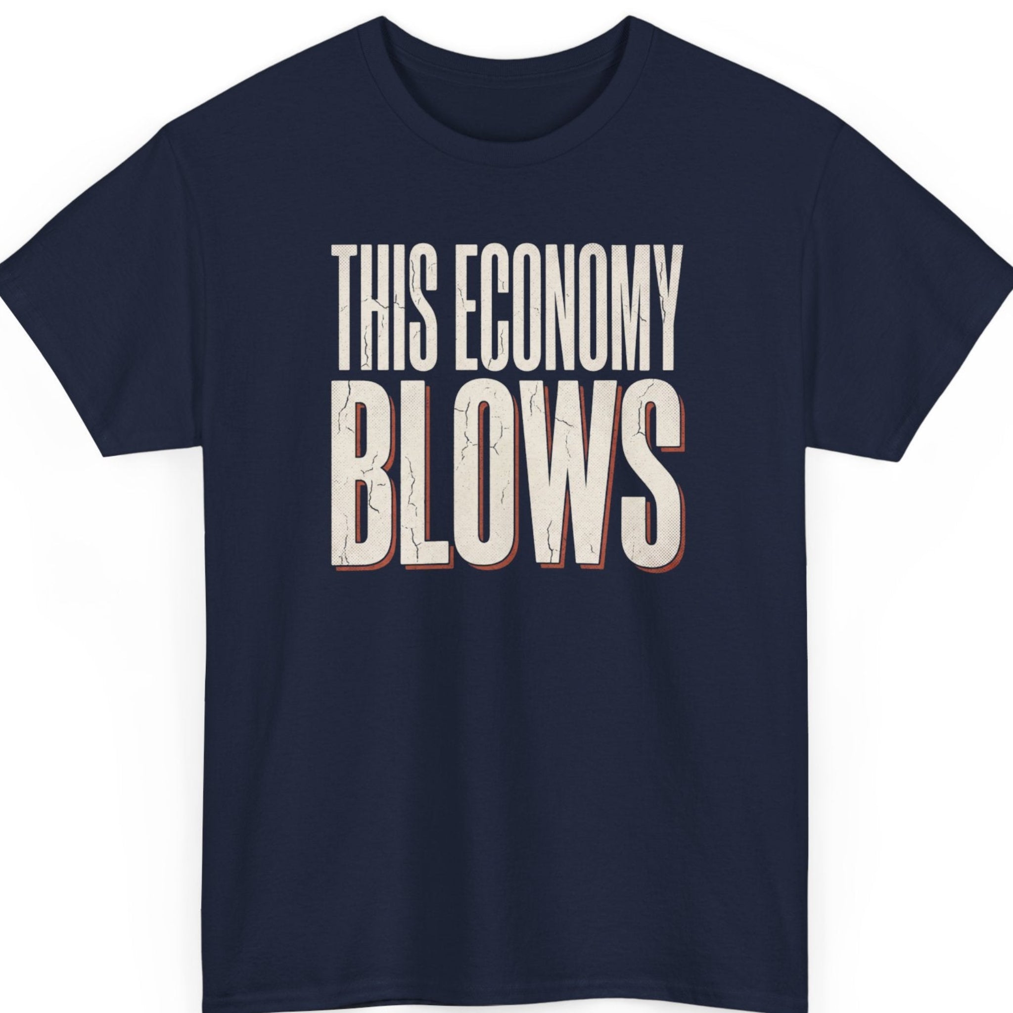 Mayhem Haus "This Economy Blows" sarcastic graphic tee on a navy blue shirt featuring distressed cream lettering with vintage red accents in a minimalist typography layout.
