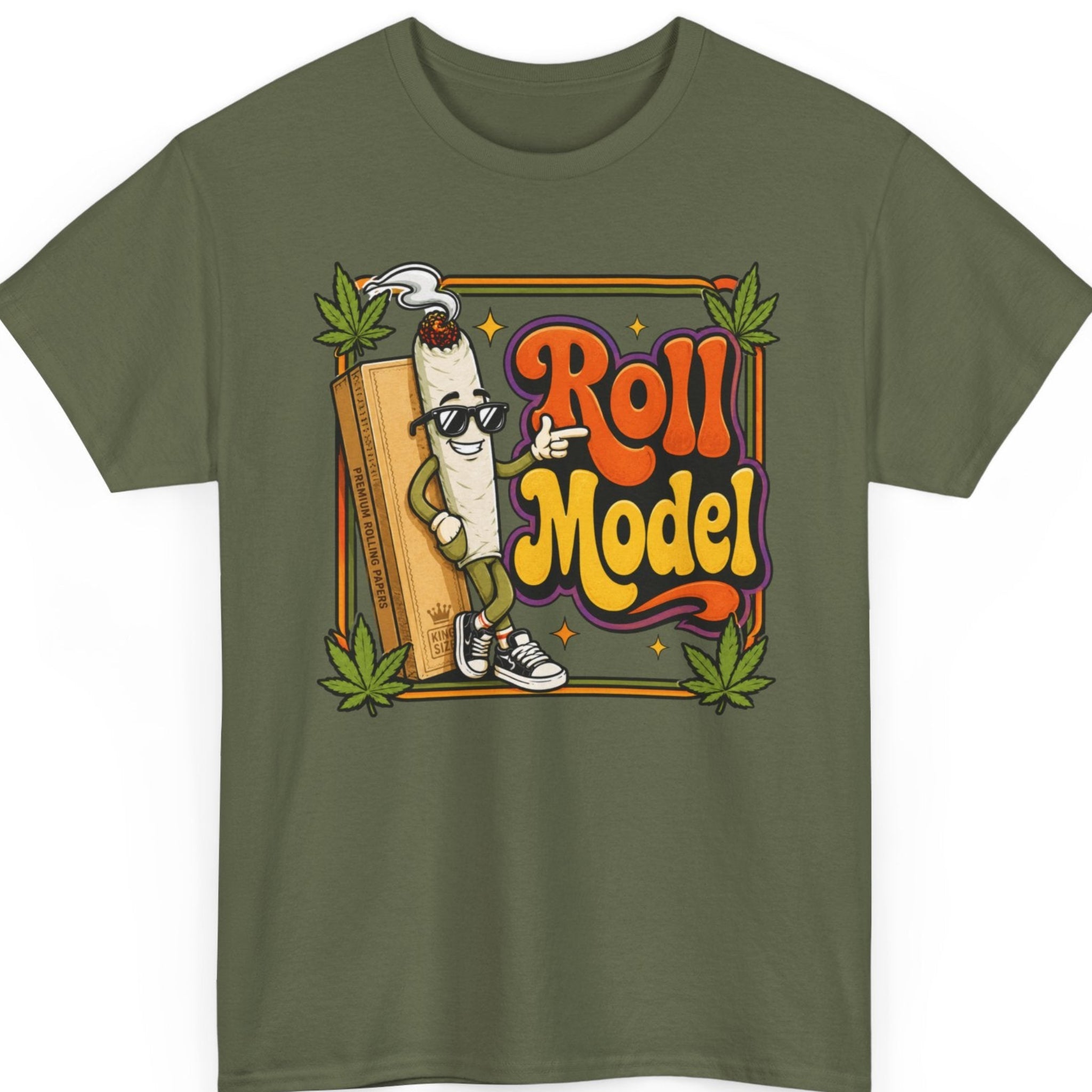 Mayhem Haus marijuana t-shirt on a military green tee featuring a playful joint mascot with sunglasses, premium rolling papers, retro typography, and cannabis leaf graphics.