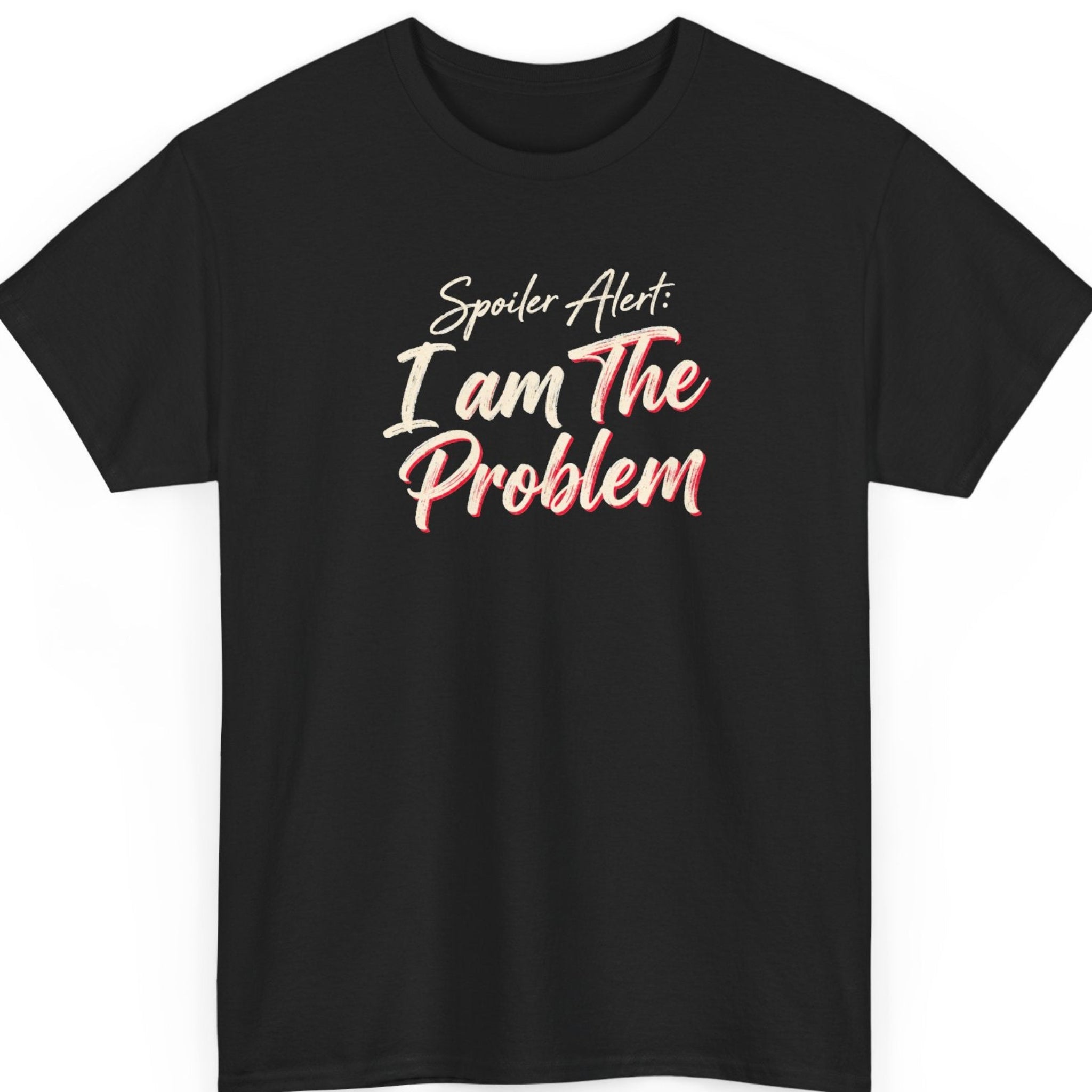 Mayhem Haus “Spoiler Alert I Am The Problem” black t-shirt featuring cream-colored handwritten script with red shadow accents, arranged in a bold, playful typography design with sarcastic self-awareness humor.