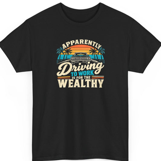 Mayhem Haus “Apparently Driving to Work Is for the Wealthy” black t-shirt featuring a vintage muscle car on a palm-lined road at sunset, with distressed cream, orange, and turquoise typography.