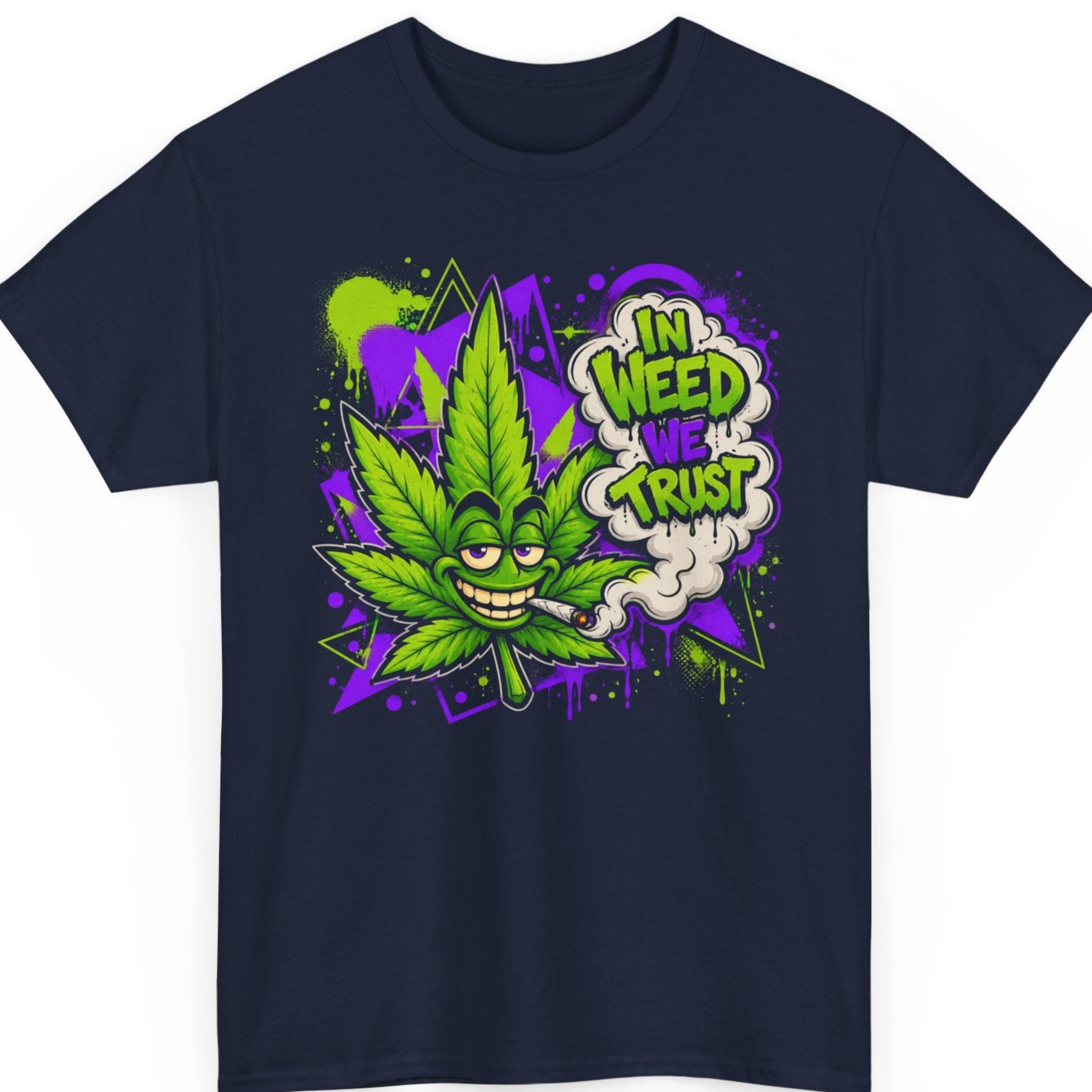 Mayhem Haus weed graphic tee on a navy blue shirt featuring a smiling cannabis leaf mascot smoking a joint with bold graffiti artwork in vibrant green and purple and the phrase "In Weed We Trust."