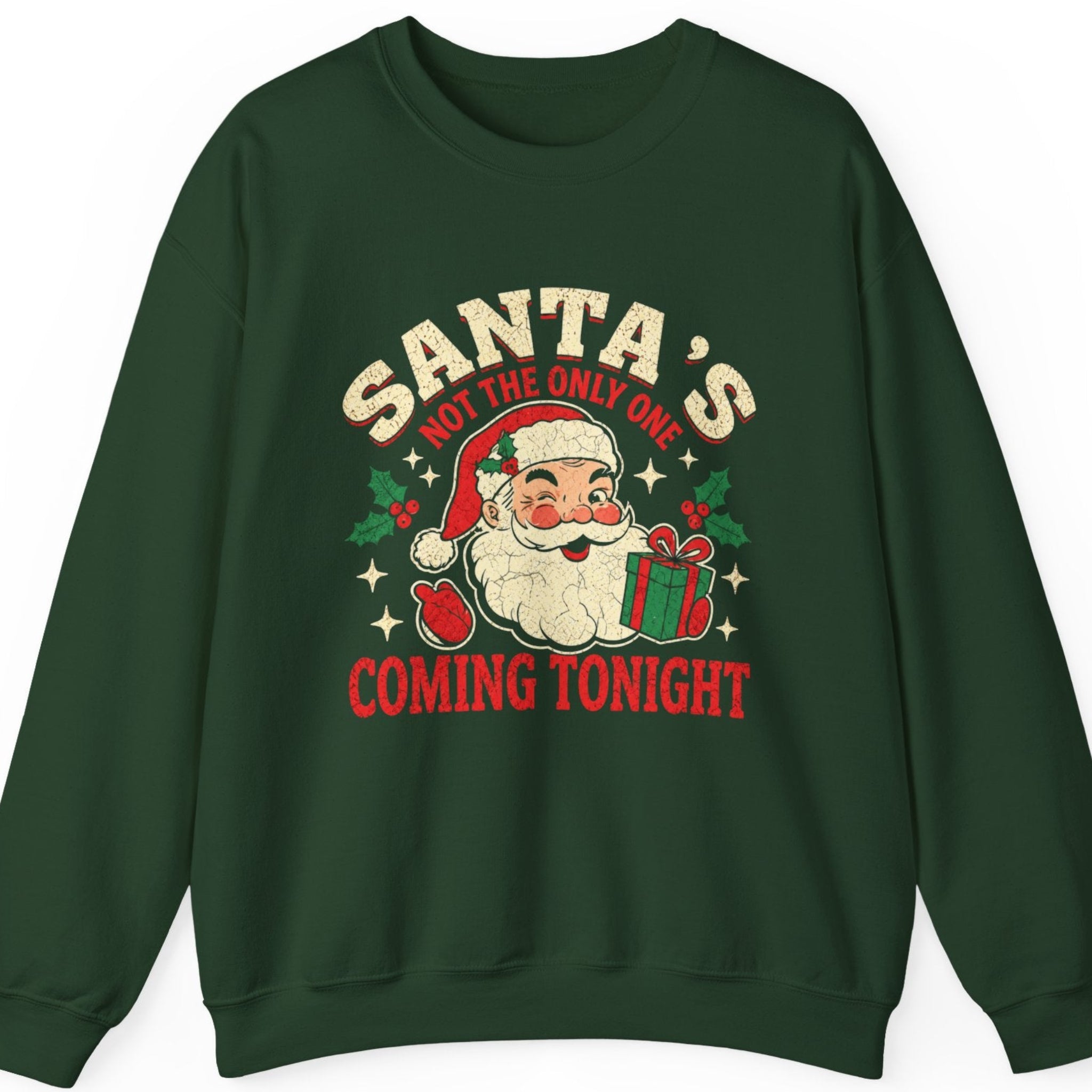 Mayhem Haus “Santa's Not the Only One Coming Tonight” forest green sweatshirt featuring a smiling vintage Santa Claus holding a green Christmas present with a red bow, surrounded by distressed cream and red lettering, holly leaves, red berries, and decorative stars. A retro Christmas design with cheeky adult holiday humor.