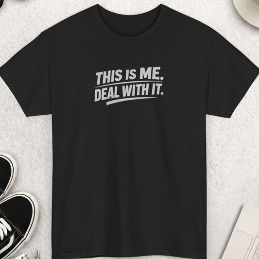 Black t-shirt with 'THIS IS ME. DEAL WITH IT.' text on a light gray surface with shoes, coffee, and accessories.