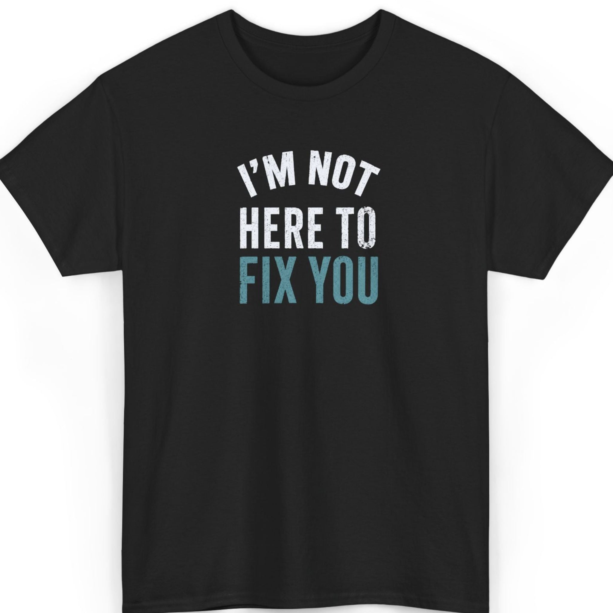 Black t-shirt with text 'I'm not here to fix you' on a white background
