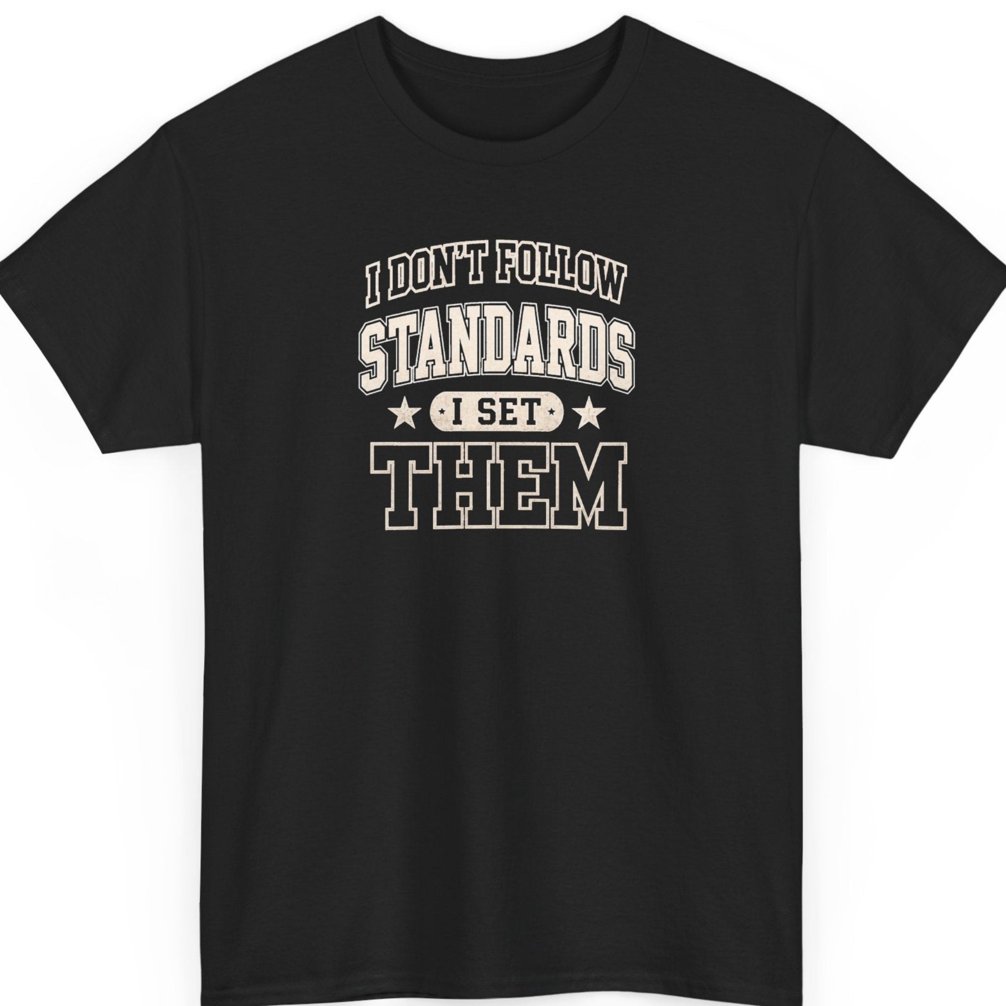 Mayhem Haus varsity typography t-shirt on a black shirt featuring distressed cream lettering reading "I Don't Follow Standards I Set Them" in a bold collegiate design with stars.