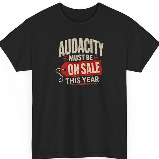 Mayhem Haus graphic t-shirt on a black shirt featuring the phrase "Audacity Must Be On Sale This Year" in distressed typography with a bold red price tag graphic for a sarcastic vintage-inspired design.