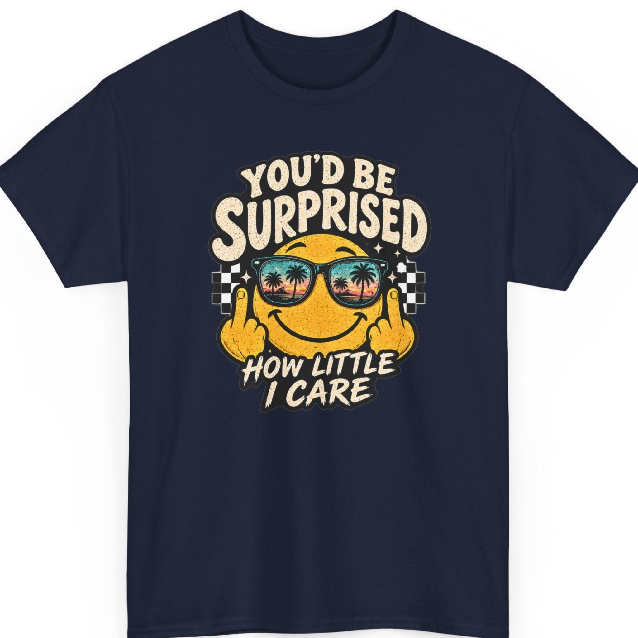 Mayhem Haus “You’d Be Surprised How Little I Care” navy blue t-shirt featuring a sarcastic smiling face in tropical sunset sunglasses giving two middle fingers with bold retro distressed lettering.