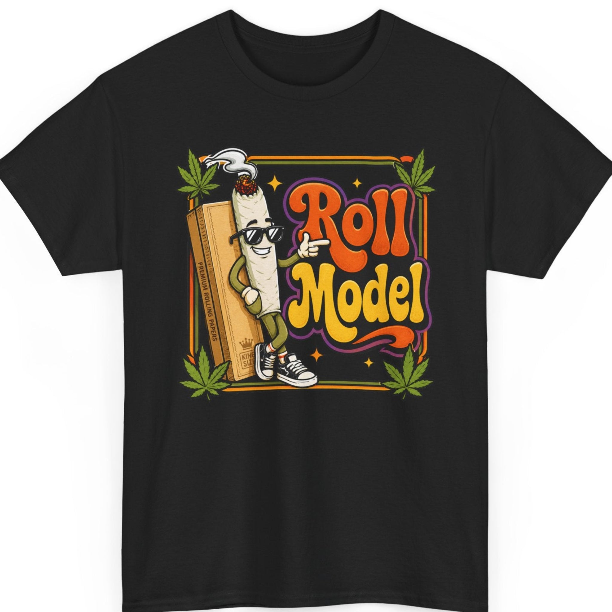 Mayhem Haus "Roll Model" cannabis graphic t-shirt on a black shirt featuring a cool cartoon joint wearing sunglasses and sneakers, leaning against a pack of rolling papers with colorful retro typography and cannabis leaves.