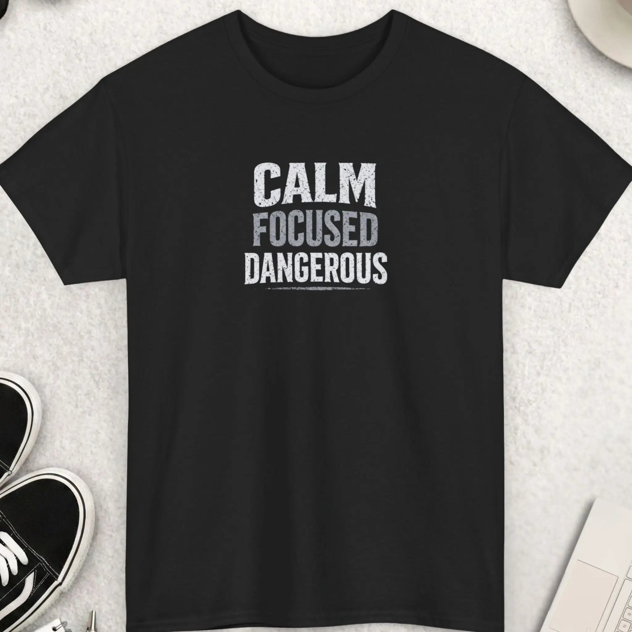 Black t-shirt with bold distressed text “Calm Focused Dangerous” motivational graphic design