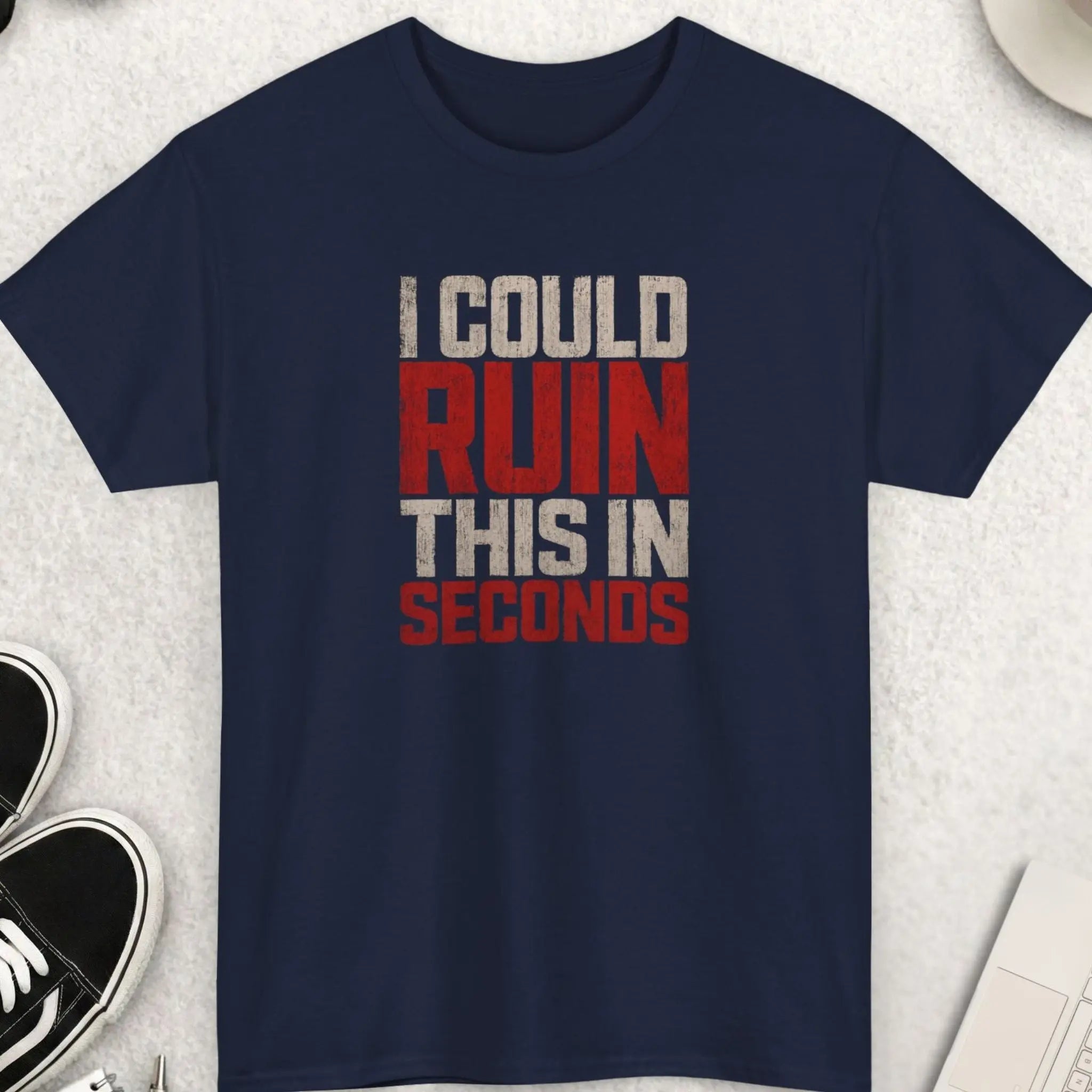 Navy blue sarcastic graphic t-shirt featuring distressed red and white typography reading “I Could Ruin This In Seconds” in bold vintage-style lettering with a grunge aesthetic.